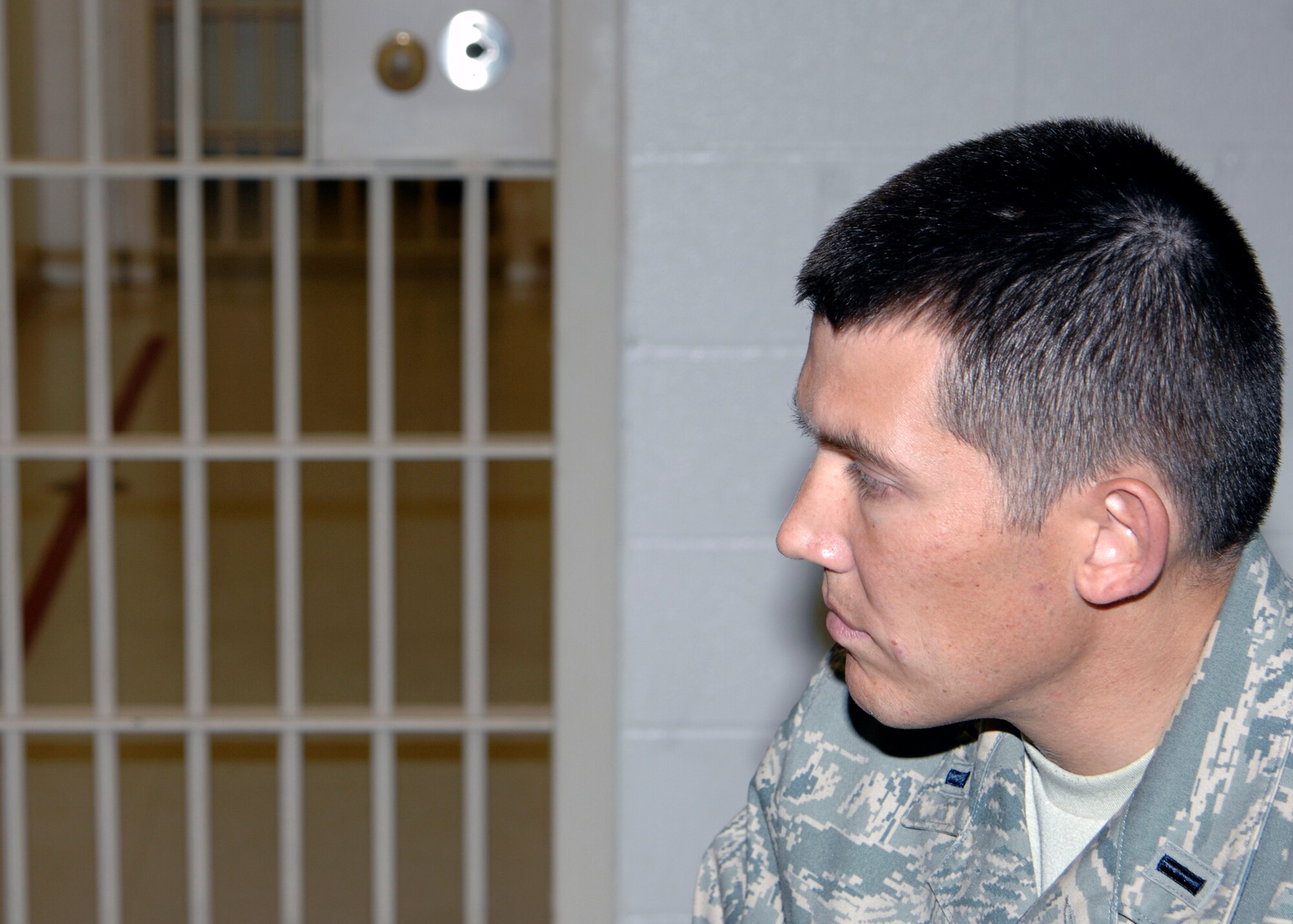 Chaplain (1st Lt.) Quentin Genke, a 22nd Air Refueling Wing chaplain, speaks with an inmate Dec. 1, 2009, at a confinement facility on McConnell Air Force Base, Kan. Chaplains visit the confinement facility to encourage morale and allow inmates an opportunity to confide in them. (U.S. Air Force photo/Justin A. Shelton) 