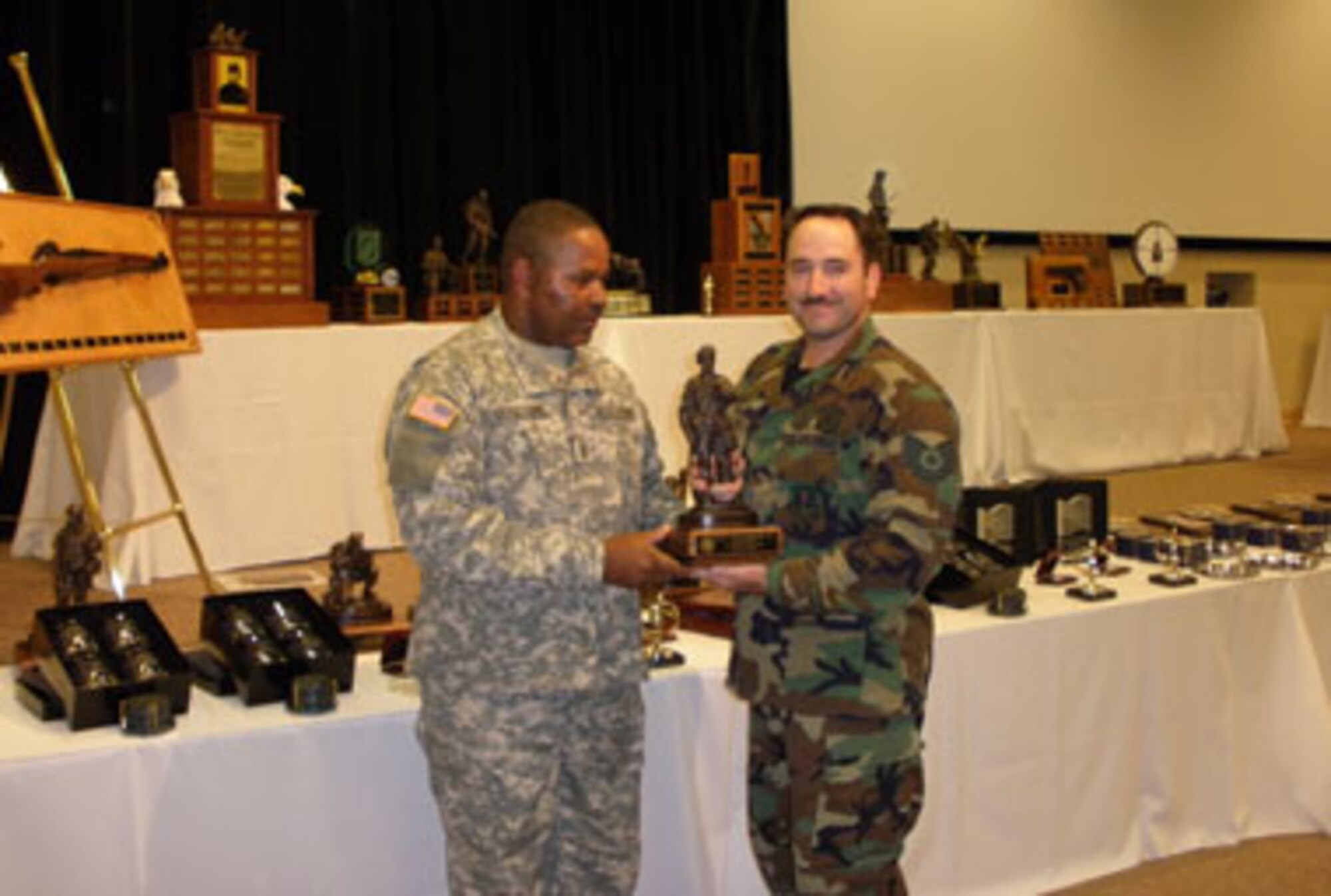 Technical Sgt. Chris Ashley, 174 Firing Team receives Individual Rifle Aggregate Champion (Open) 1st Place Trophy making TSgt Ashley the "Top" rifle shooter in the National Guard. (Courtesy Photo/RELEASED)