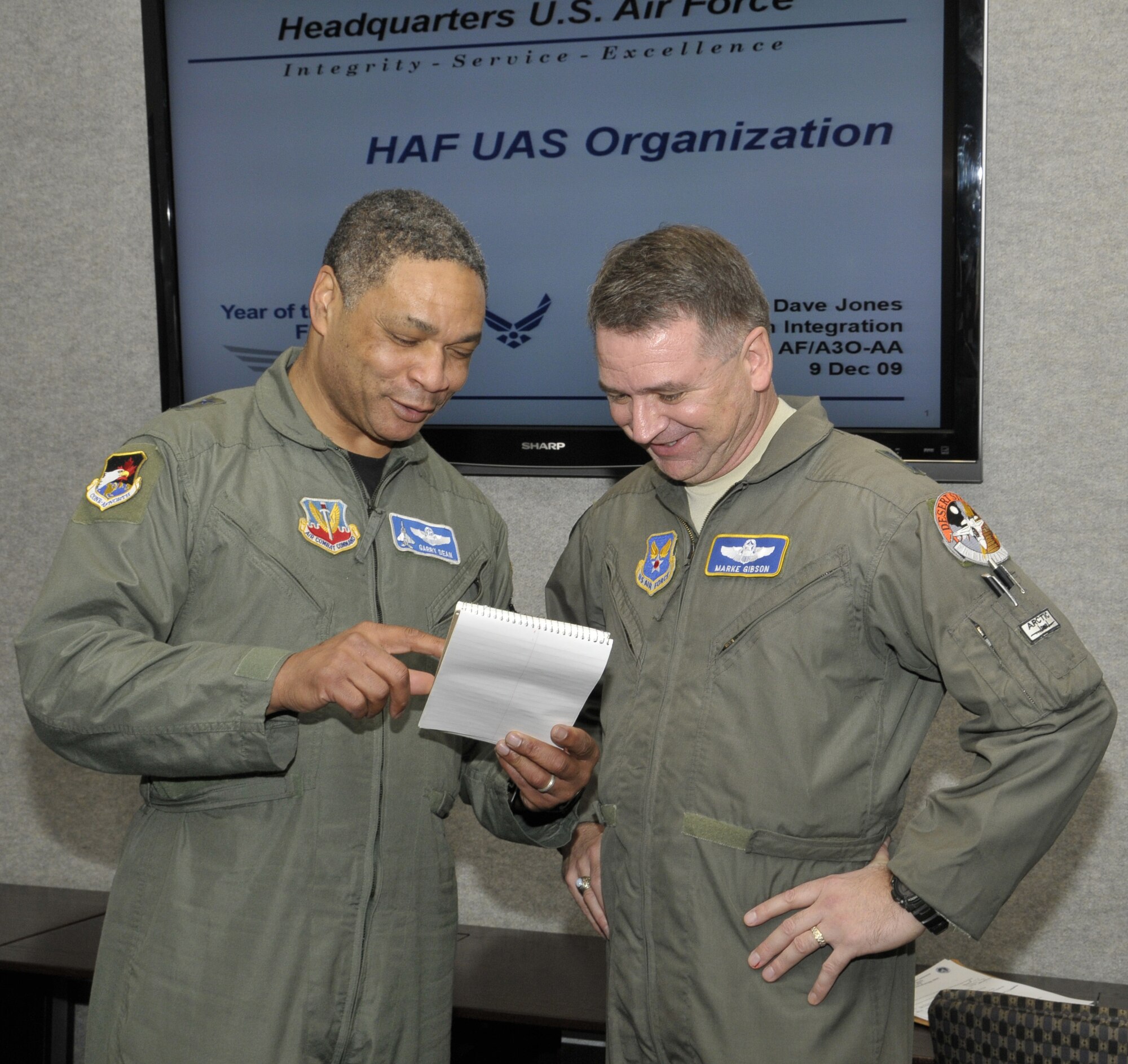 Maj. Gen. Garry Dean, First Air Force commander, (left) and Maj. Gen. Marke Gibson, director of operations and deputy chief of staff for Air Force Operations, Plans and Requirements at the Pentagon, discuss how the Air Force can improve access into the National Airspace System at a conference held at First Air Force in early December.  (U.S. Air Force photo by Lisa Norman)