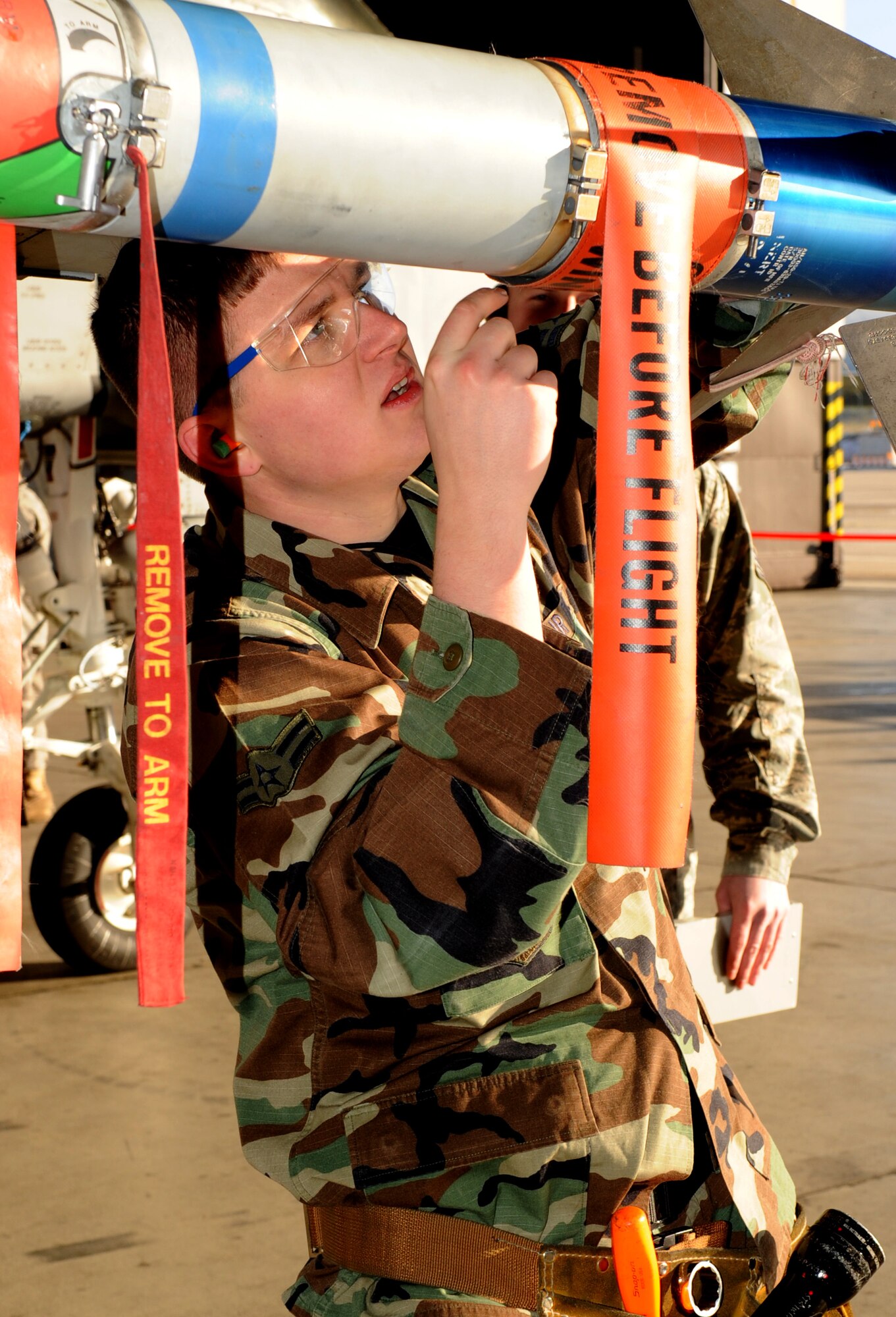 SPANGDAHLEM AIR BASE, Germany –Airman 1st Class Daniel Booth, 81st Aircraft Maintenance Unit, participates in the fourth quarter Weapons Load Crew Competition for the 81st Fighter Squadron Dec. 18. The 22nd and 81st Fighter Squadrons put together three-man teams and competed against each other to load weapons onto an F-16 Fighting Falcon and an A-10 Thunderbolt II in the fastest time. The 81st FS won the fourth quarter competition. (U.S. Air Force photo/Airman 1st Class Staci Miller)