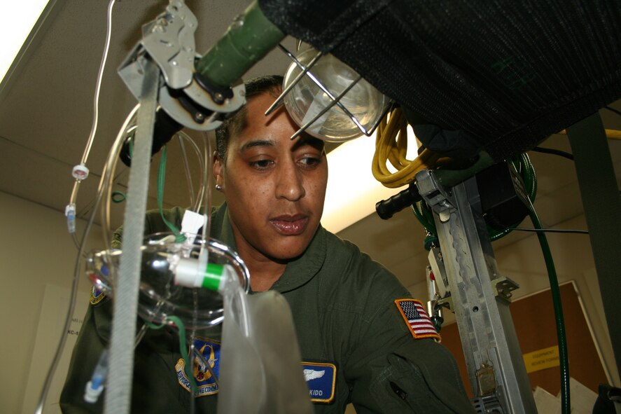 Tech. Sgt. Sonya Kidd monitors a simulated patient during training Nov. 15. AES Airmen care for the sick and wounded during flight. AES transported more than 12,000 patients in 2009 (U. S. Air Force photo/Senior Airman Matthew Cook)