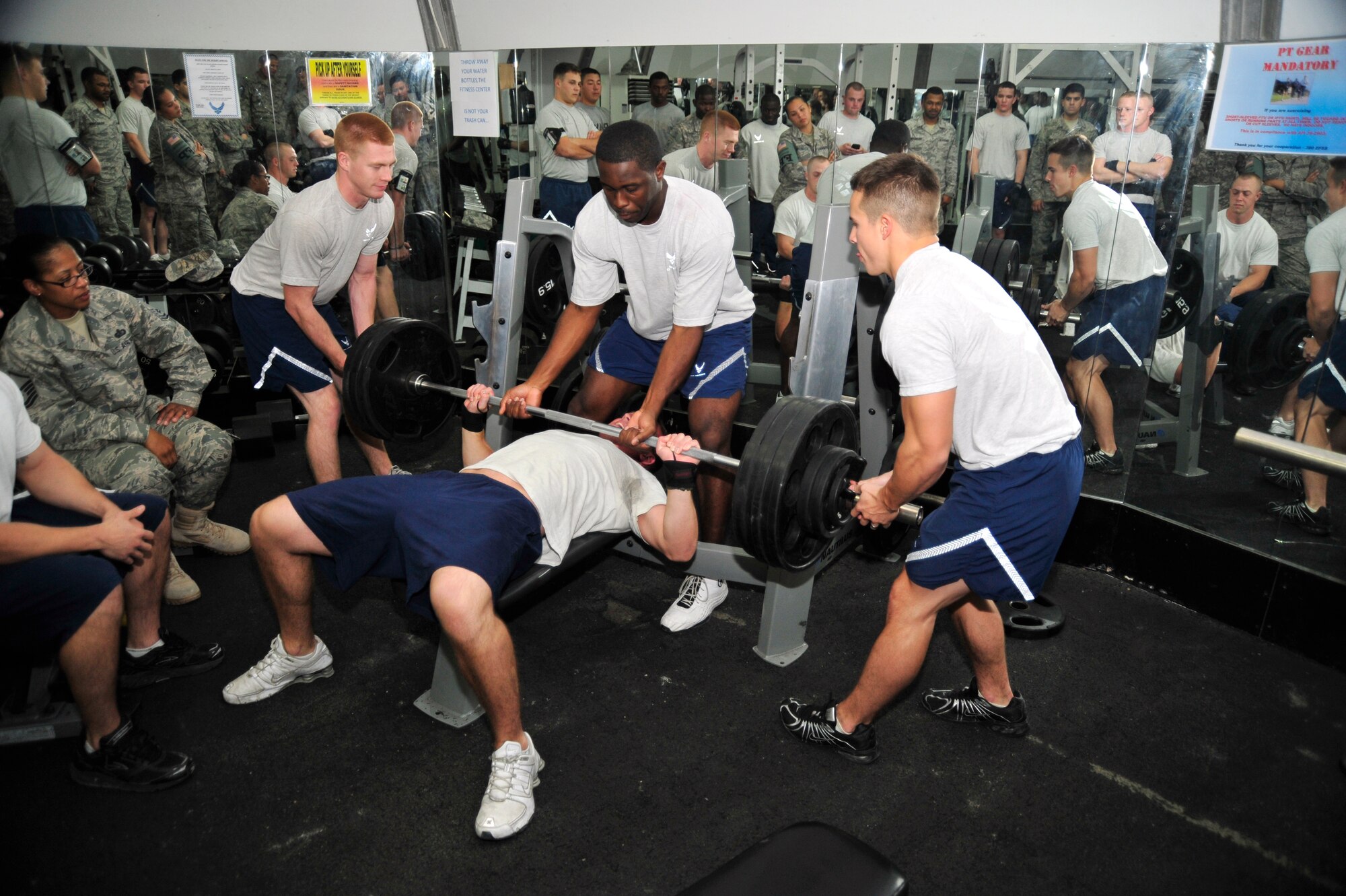 SOUTHWEST ASIA – Spotters help Senior Airman Kenneth Yetter, 380th Expeditionary Civil Engineer Squadron, with an attempted bench press of 360 pounds at the “Strongest in the AOR” competition Dec. 18, 2009. Airman Yetter is deployed from Dover Air Force Base, Del., and hails from Spokane Washington. Airman Yetter was named the strongest man at the 380th Air Expeditionary Wing. (U.S. Air Force photo/Tech. Sgt. Charles Larkin Sr)