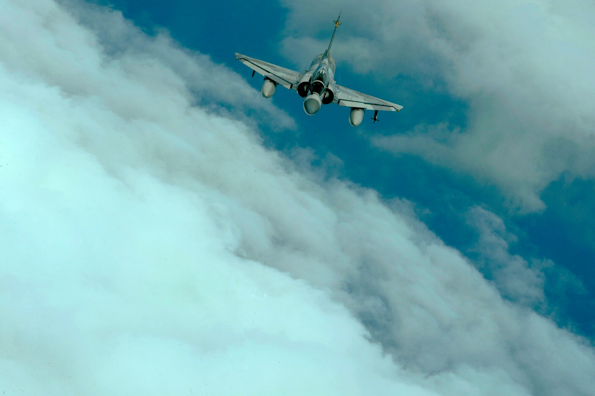 An Emirati Mirage 2000 approaches a 908th Expeditionary Air Refueling Squadron KC-10A Extender to refuel during a multinational exercise, Dec. 6, 2009.  Aircrews from France, Jordan, Pakistan, the U.A.E., the U.K., and the U.S. trained together in the Air Forces Central area of responsibility in fighting a large-scale air war.  (U.S. Air Force photo by Staff Sgt. Michael B. Keller) (Released)


