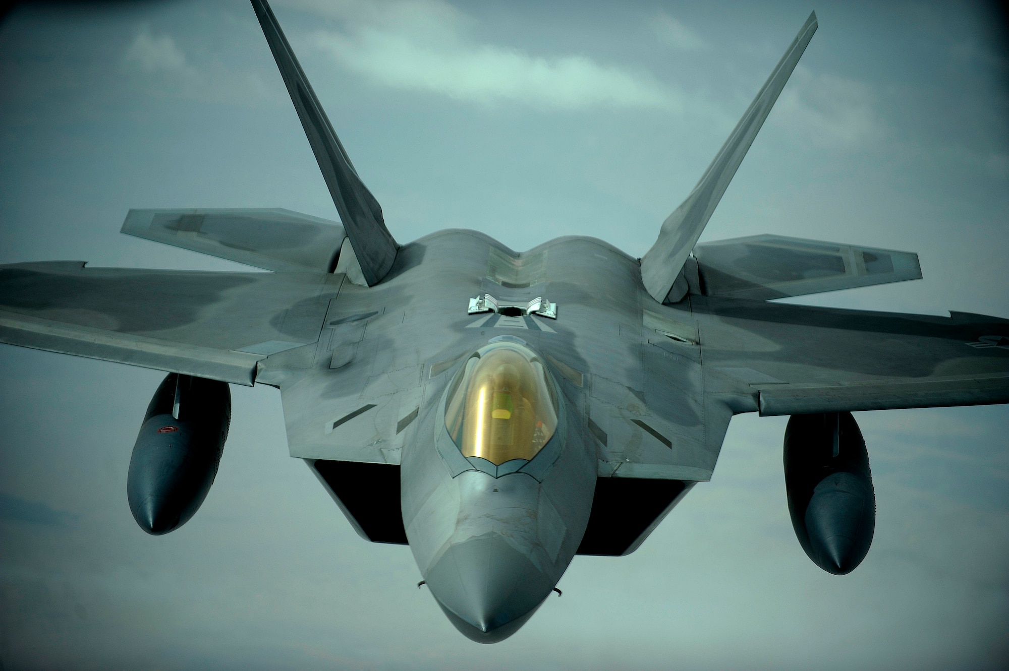 A U.S. Air Force F-22 Raptor approaches a 908th Expeditionary Air Refueling Squadron KC-10A Extender to refuel, Dec.  6, 2009.  The F-22 fighters and crews are deployed from the 27th Fighter Squadron at Langley Air Force Base, Va., and in the Air Forces Central area of responsibility for the first time as part of a multinational exercise where aircrews from France, Jordan, Pakistan, the U.A.E., the U.K., and the U.S. trained together in fighting a large-scale air war.  (U.S. Air Force photo by Staff Sgt. Michael B. Keller) (Released)


