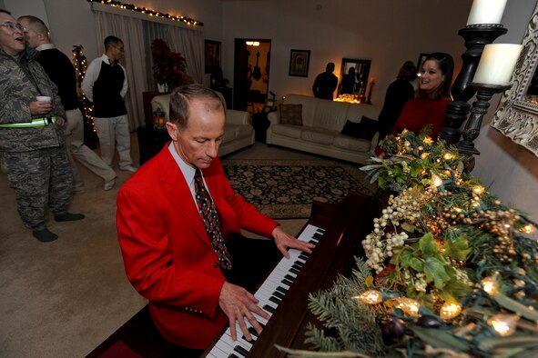 MISAWA AIR BASE, Japan -- Col. David Stilwell, 35th Fighter Wing commander, plays a rendition of Vince Guaraldi's "Linus and Lucy" Dec. 18 during an open house at the Stilwell residence. "Linus and Lucy" is popularly known as the Peanuts theme song. (U.S. Air Force photo/Senior Airman Jamal D. Sutter)