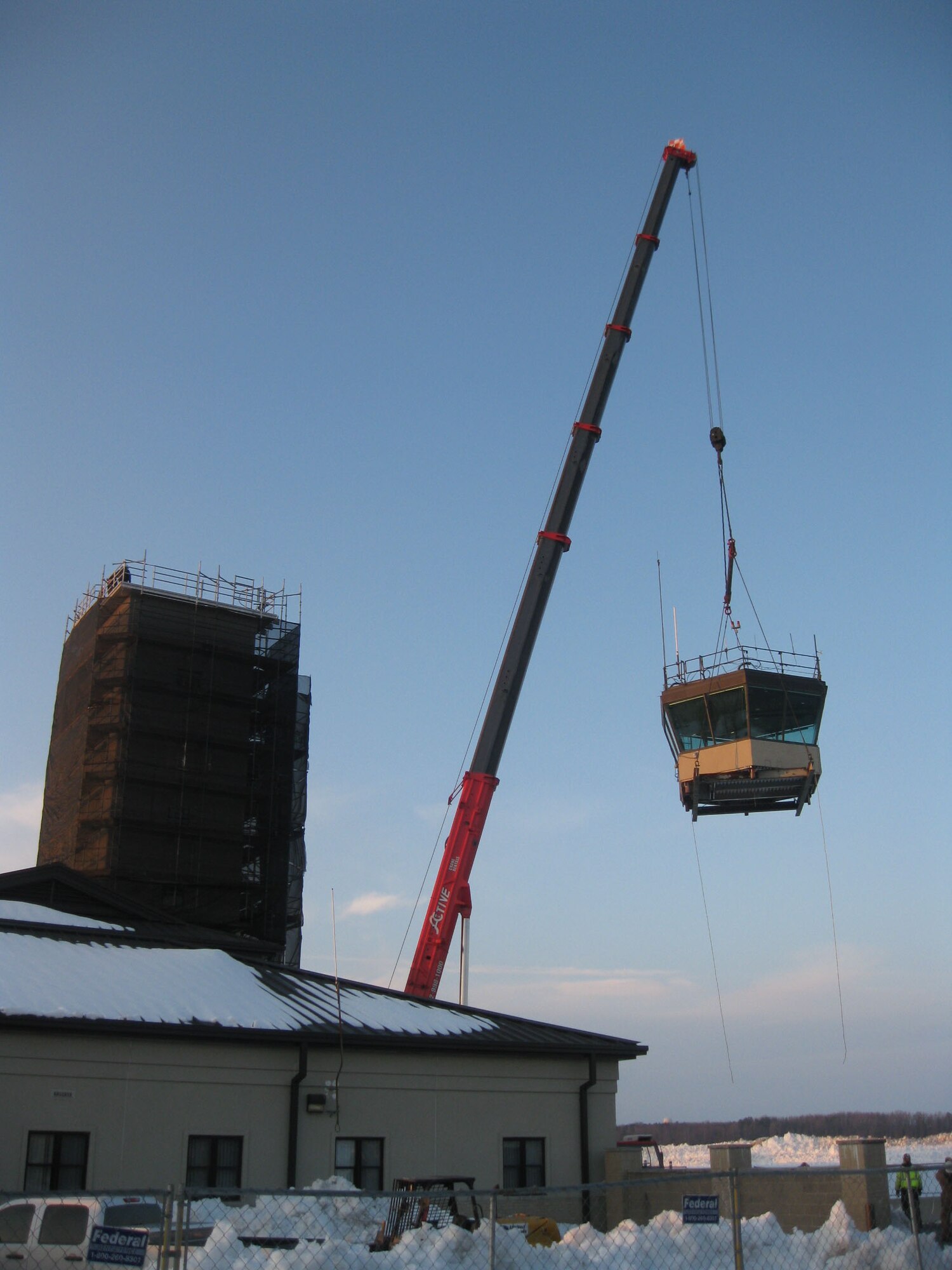 Base contractors remove the old air traffic control tower at Dover Air Force Base Dec. 22. The tower was constructed in 1955 and was replaced with a new new air traffic control tower Oct. 26. The new tower features upgraded equipment and will help to increase the overall safety of flight operations at Dover. (U.S. Air Force photo/Joan Cote)
                           