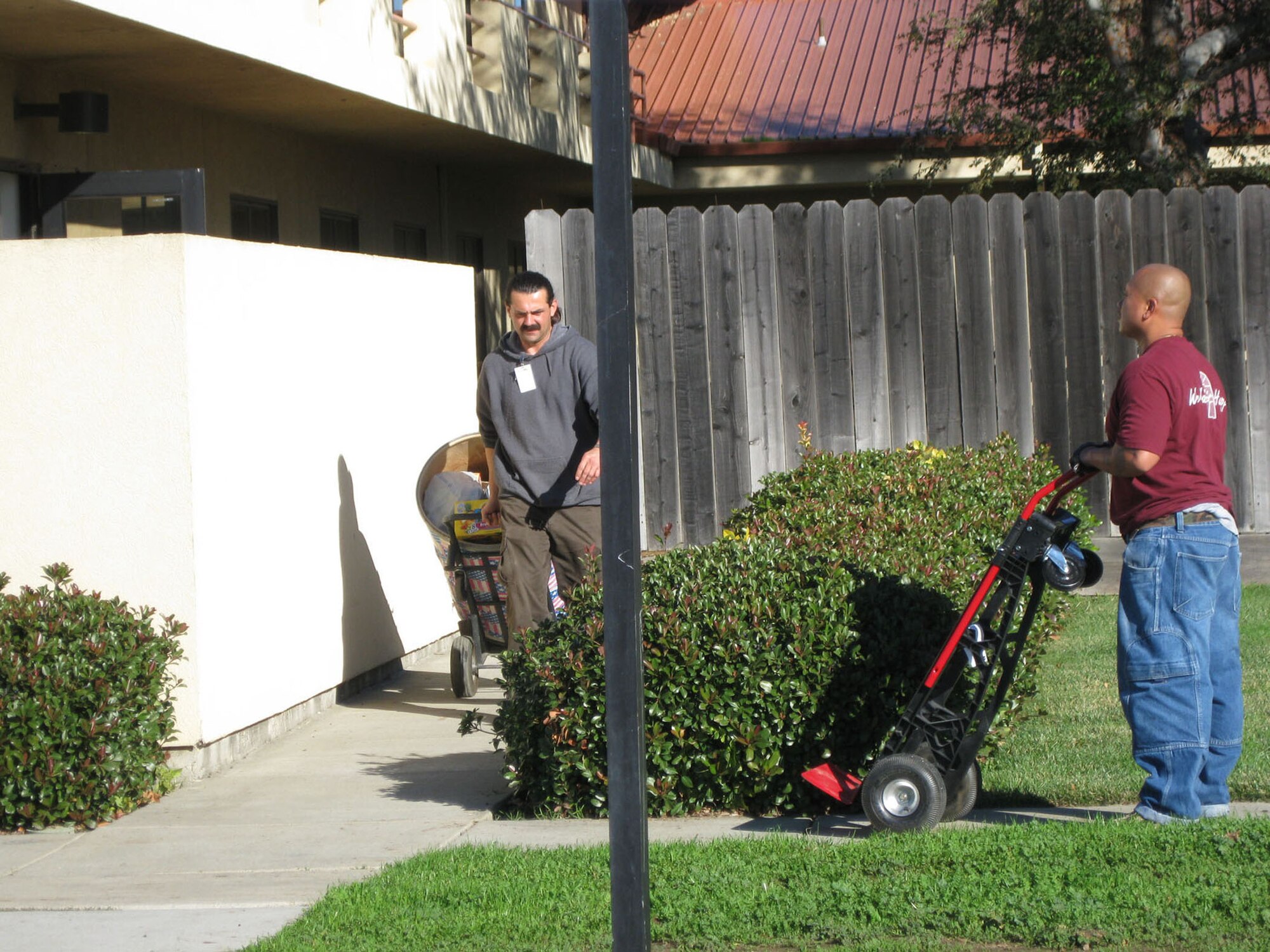 TRAVIS AIR FORCE BASE, Calif. -- The men and women of the 349th Air Mobility Wing have generously donated more than 5,460 pounds of food to the 349th Chaplain’s Annual Holiday Food Drive. Helpers from the local area food bank took time out to help load up the final truck of donations here, Dec. 22.  (U.S. Air Force photo/Patti Schwab-Holloway)     