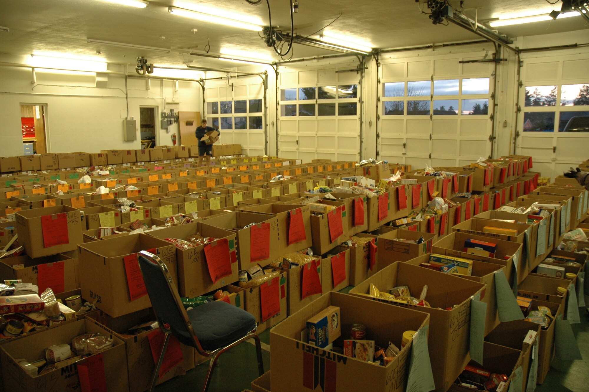 TACOMA, Wash.- Rows of Christmas food baskets made by workers with the Central Pierce County Fire and Rescue Department here are ready to be distributed to families in need during the holiday season. Reservists with the 446th Mission Support Squadron Airmen and Family Readiness Center, McChord Air Force Base, Wash. came here to pick up 34 baskets of food to bring back to McChord AFB and distribute to needy Reservist families. (U.S. Air Force photo/Master Sgt. Jake Chappelle)