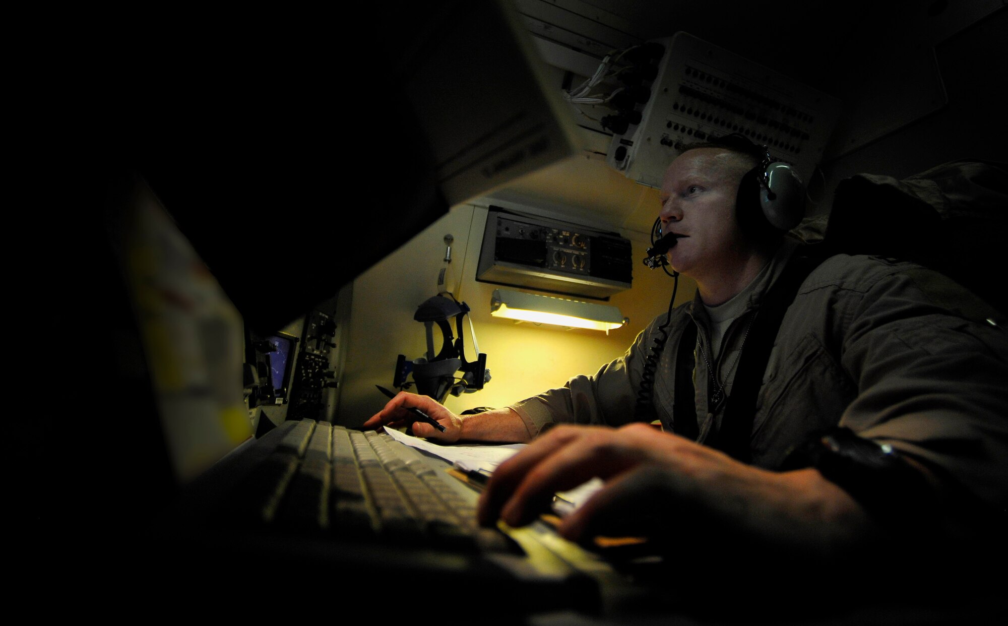 U.S. Air Force Capt. Ronald Alligood, 7th Expeditionary Air Command and Control Squadron, Joint Surveillance Target Attack Radar System navigator, stationed at Robins Air Force Base, Ga., deployed to Southwest Asia, sets up an orbit course for the JSTARS to fly, Dec. 18, 2009.  Setting up an orbit course maximizes the radar coverage JSTARS will receive during this mission over Iraq.  JSTARS is a command and control platform that conducts ground surveillance to support attack operations and contributes to the disruption of enemy forces. (U.S. Air Force photo/Staff Sgt. Angelita Lawrence) 