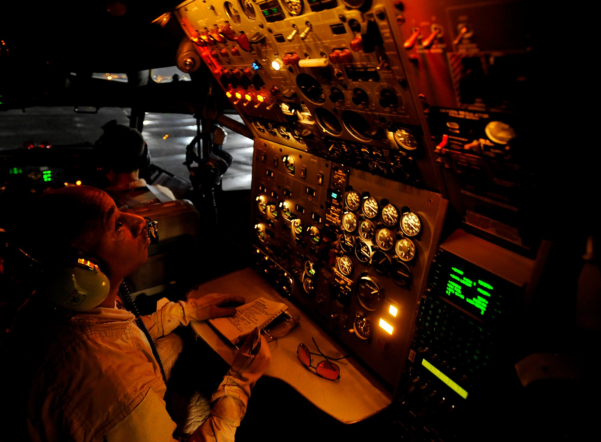 SOUTHWEST ASIA -- U.S. Air Force Master Sgt. William Taylor, 7th Expeditionary Air Command and Control Squadron, Joint Surveillance Target Attack Radar System flight engineer, stationed at Robins Air Force Base, Ga., deployed to Southwest Asia, completes his checklist before engine start, Dec. 18, 2009.  JSTARS is a command and control platform that conducts ground surveillance to support attack operations and contributes to the disruption of enemy forces. (U.S. Air Force photo/Staff Sgt. Angelita Lawrence)