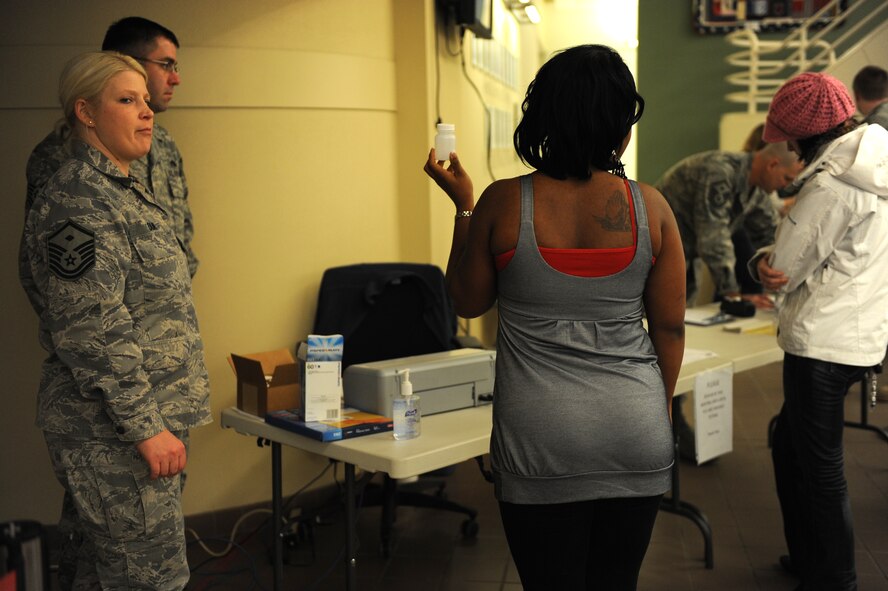 MINOT AIR FORCE BASE, N.D. -- Airmen process through a urinalysis line during Operation PrairieHawk 10A here Dec. 19. First sergeants from both the 5th Bomb Wing and the 91st Missile Wing checked vehicles after they entered the installation and directed Airmen to the clinic for the urinalysis inspection during the sweep. The gate sweep was ordered to both ensure the fitness for duty of Airmen at Minot AFB and to present a visible and present deterrent to drug use. (U.S. Air Force photo by Staff Sgt. Stacy Moless)