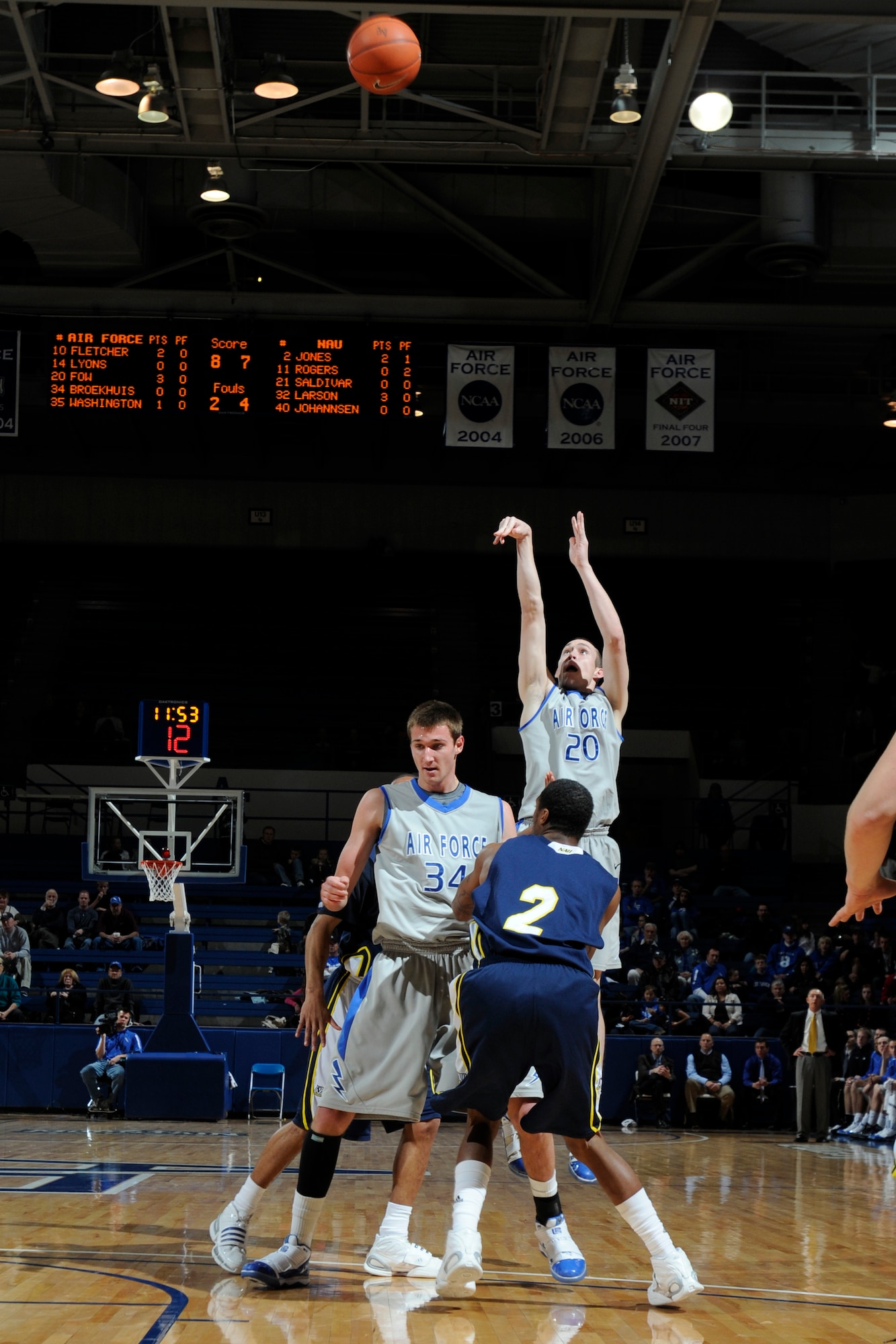 Falcons junior forward Tim Fow takes a three-point shot during the Air Force-Northern Arizona game at the Air Force Academy's Clune Arena Dec. 19, 2009. Fow, a native of Scottsdale, Ariz., led the Falcons in scoring with 15 points, including three shots from three-point territory, in their 60-52 loss to the Lumberjacks. (U.S. Air Force photo/J. Rachel Spencer)