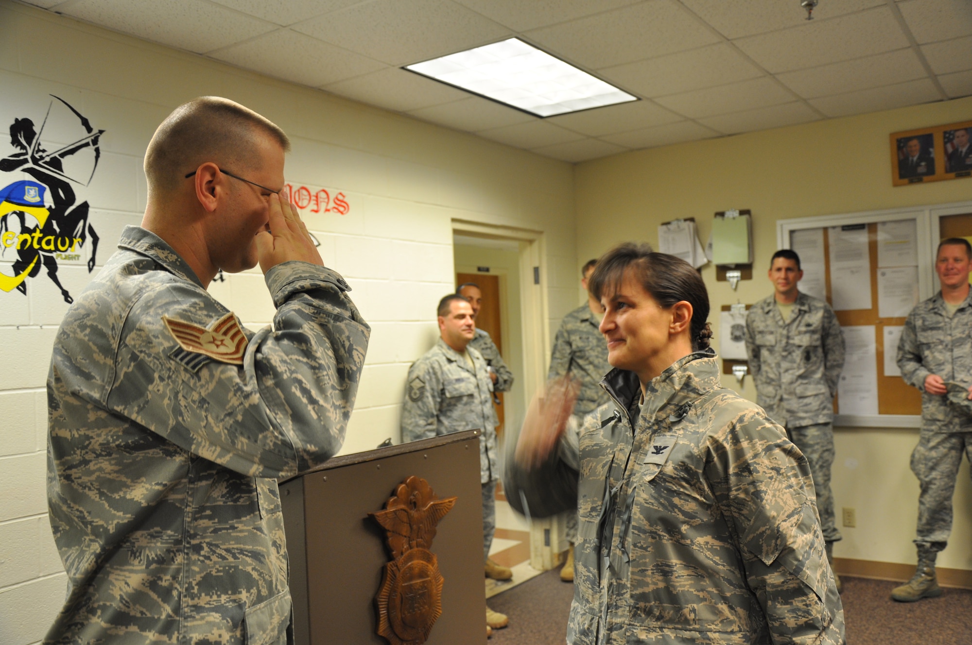 Tech. Sgt. Daniel Nienhaus, an 82nd Security Forces Squadron investigator, salutes Col. Kimberley Ramos, 82nd Mission Support Group commander, Dec. 22after he was selected for promotion under the Stripes for Exceptional Performers program which releases a limited number of slots each year to major commands to fill for ranks E-5 through E-7. (U.S. Air Force Photo/ Airman 1st Class Adawn Kelsey)