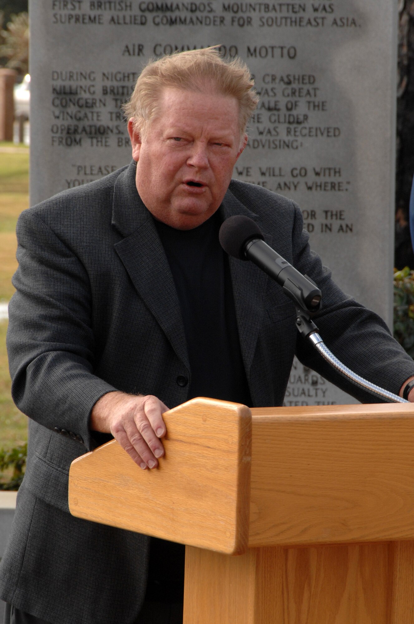 Retired Air Force Brig. Gen. George Gray, former 1st Special Operations Wing commander, speaks at the commemoration of the 20th anniversary of Operation Just Cause at the Hurlburt Field Airpark Dec. 18. General Gray also led the 1st SOW in Operation Desert Shield before retiring in December 1994. (U.S. Air Force photo by Senior Airman Matthew Loken)