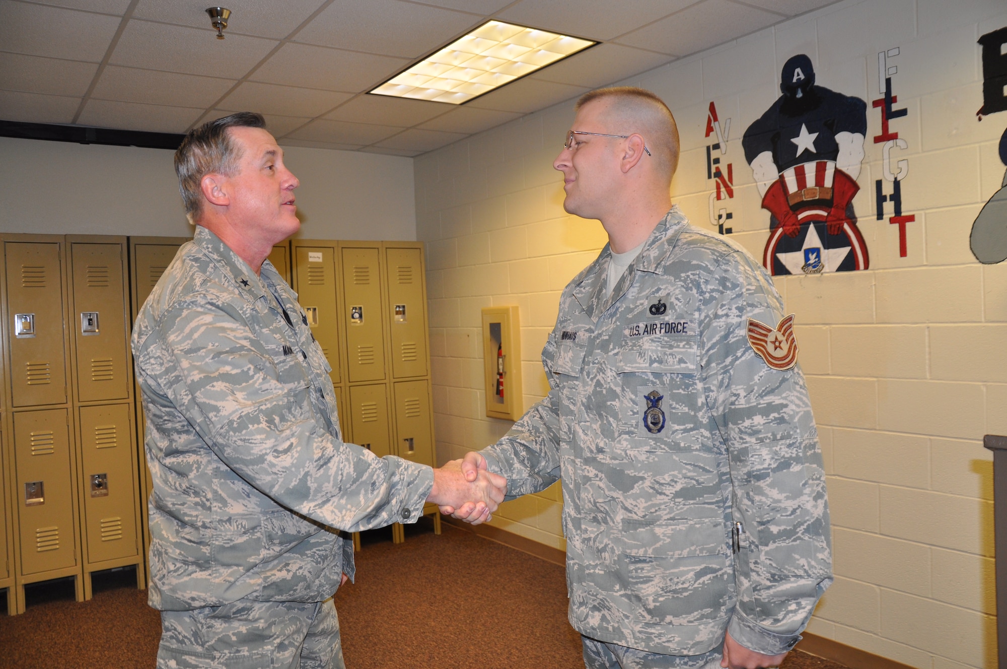 Brig. Gen. O.G. Mannon, 82nd Training Wing commander, coins Tech. Sgt. Daniel Nienhaus, an 82nd Security Forces Squadron investigator, Dec. 22 after he was selected for promotion under the Stripes for Exceptional Performers program. The STEP program releases a limited number of slots each year to major commands to fill for ranks E-5 through E-7. (U.S. Air Force Photo/ Airman 1st Class Adawn Kelsey)
