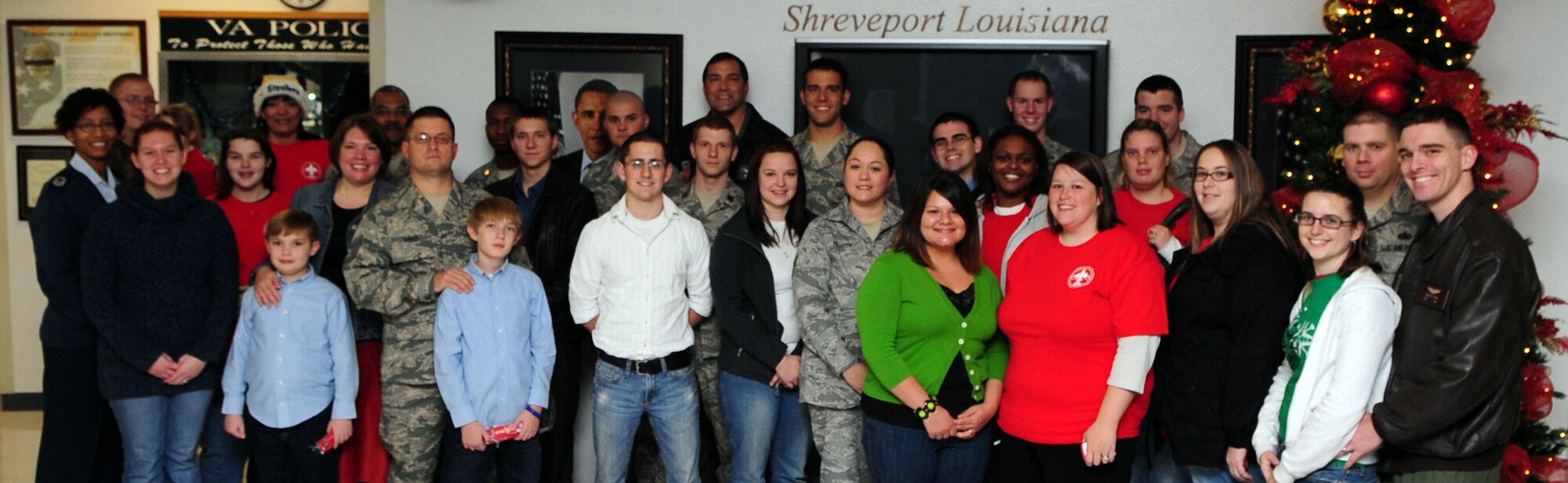 SHREVEPORT, La. -- Volunteers pose for a group photo at the Overton Brooks Veterans Affairs Hospital, Dec. 19. Volunteers delivered more than one hundred Christmas cards to sick and injured veterans. The cards were collected by the Barksdale Air Force Base Enlisted Spouses Group from base and local community drop boxes, and delivered by the BESG, Airmen and their families. (U.S. Air Force photo by Senior Airman Joanna M. Kresge) 