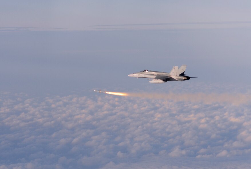 A pilot of the 409th Canadian Air Force fires an AIM 7 from an F-18 Hornet
during Weapon System Evaluation Program 10-03 on Dec. 4 at Tyndall Air Force Base, Fla. The WSEP program, run by the 53rd Weapons Evaluation Group, 83rd Fighter Weapons Squadron, is used to evaluate the effectiveness and suitability of combat air force weapon systems for aircrew and maintainers. The 53rd Wing headquarters is located on Eglin AFB, Fla.  (U.S. Air Force photo/ Tech.Sgt. Jason Wilkerson)


