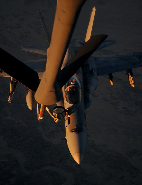 SOUTHWEST ASIA -- A Navy F-18 Hornet refuels from an Air Force KC-135 over Afghanistan Dec. 17.  (U.S. Air Force photo/Staff Sgt. Austin M. May)