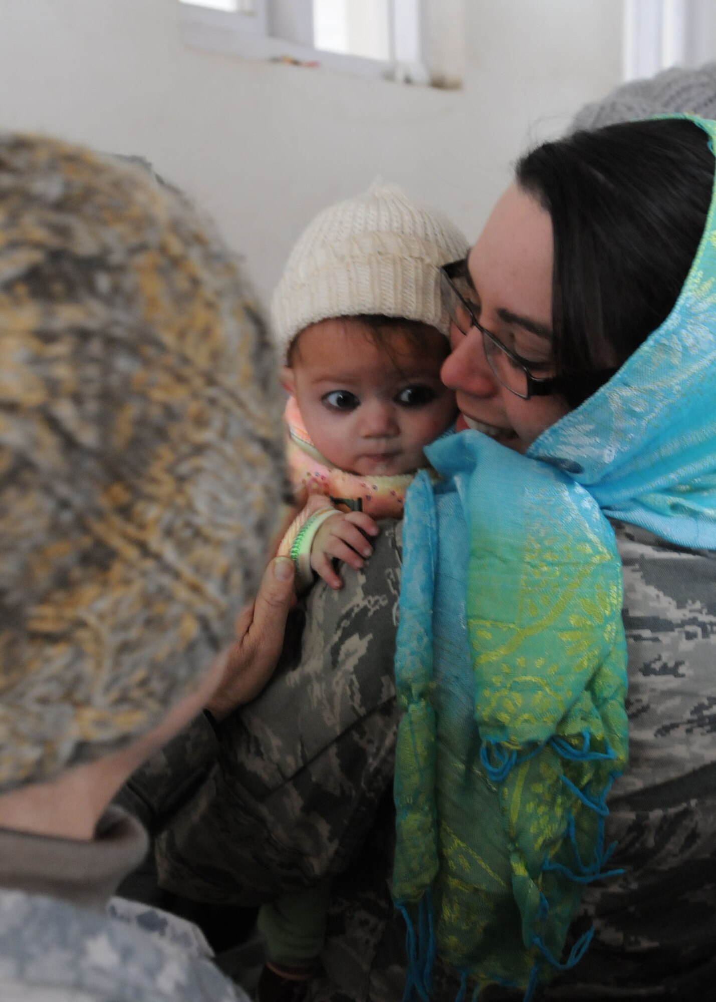 BAGRAM AIRFIELD, Afghanistan -- Staff Sgt. Danielle Sempter holds a 6 month old Afghan child during a visit to an all-girls school in the Panjshir valley in Afghanistan. Sergeant Sempter is from Swansborough, N.C. and is deployed from Ramstein Air Base, Germany.  (U.S. Air Force photo/Senior Airman Susan Tracy)
