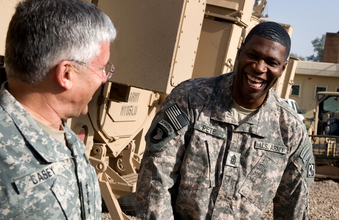 U.S. Army 1st Sgt. Ezell Pete, right, and U.S. Army Chief of Staff Gen. George W. Casey Jr., left, have a laugh in Balad, Iraq, Dec. 20, 2009.