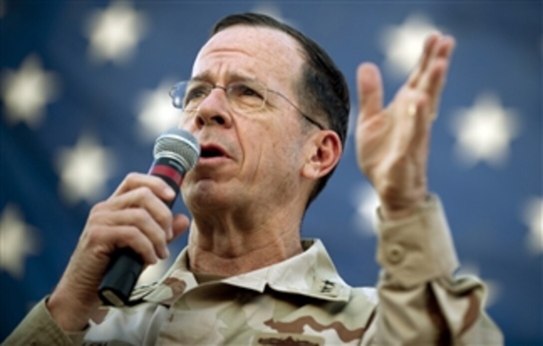 Chairman of the Joint Chiefs of Staff Adm. Mike Mullen, U.S. Navy, opens the USO holiday troop visit to Al-Asad Air base in Iraq on Dec. 19, 2009.  Mullen and his wife Deborah are hosting the tour with tennis star Anna Kournikova, comedian Dave Attell, tennis coach Nicholas Bollettiere and musician Billy Ray Cyrus visiting troops in Afghanistan, Iraq and Germany.  