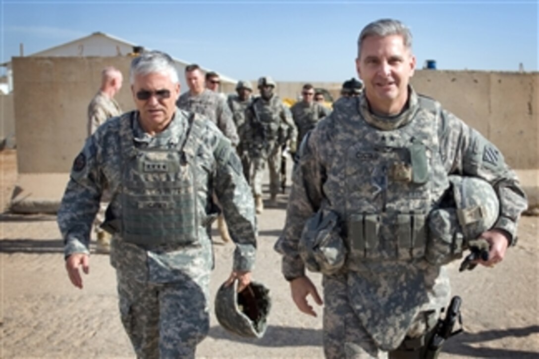 Chief of Staff of the Army Gen. George W. Casey Jr. and 3rd Infantry Division Commander Maj. Gen. Tony Cucolo walk together at Ramadi, Iraq, on Dec. 20, 2009.  