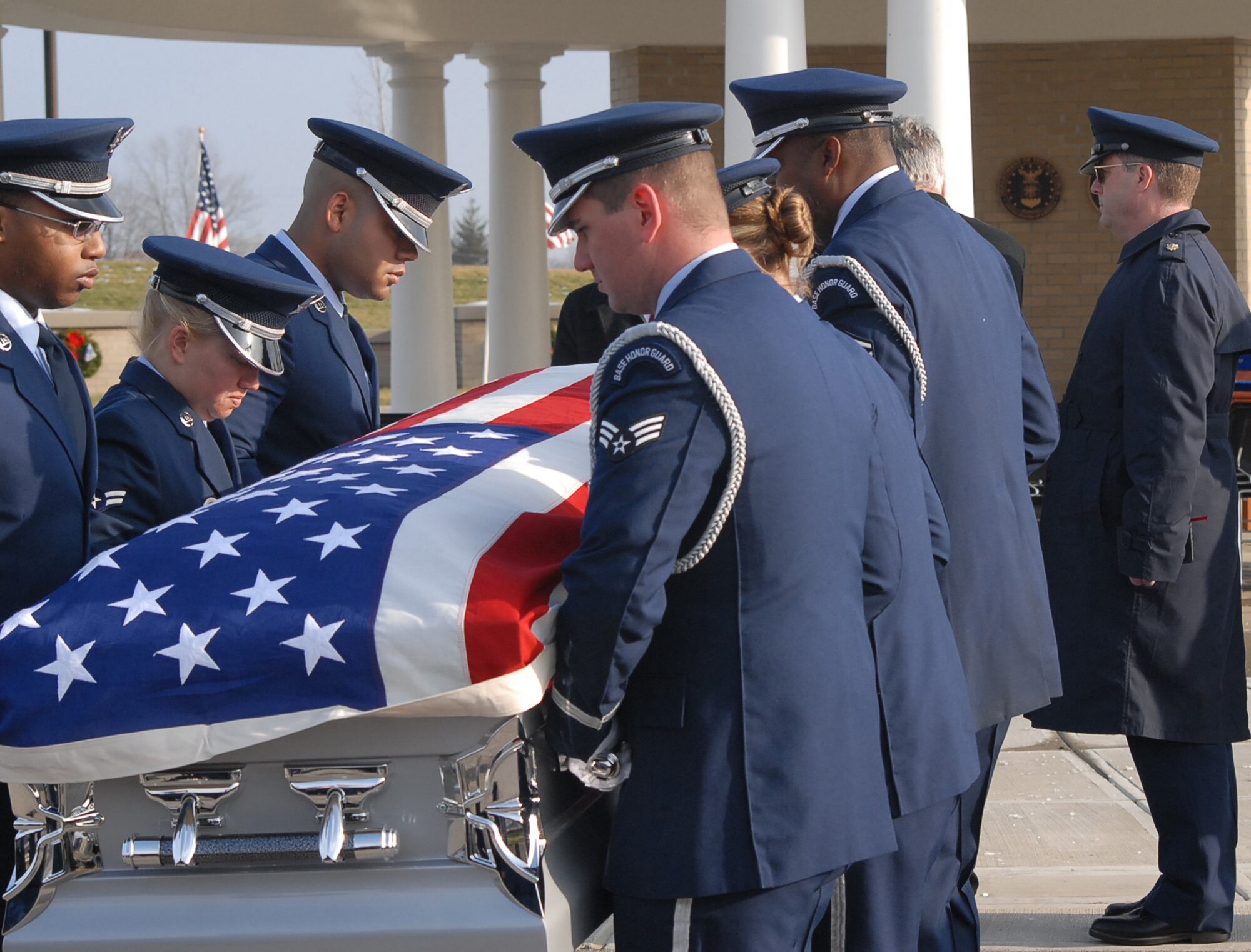 Air Force honor guard members and 932nd Airlift Wing chaplain (Maj.) Howard Bell say farewell to Tech. Sgt. Anthony Campbell in a ceremony held Tuesday.  He died December 15 during Operation Enduring Freedom and was buried December 22 at Kentucky Veterans Cemetery in Williamstown, Ky.  (U.S. Air Force photo/Maj. Stan Paregien)