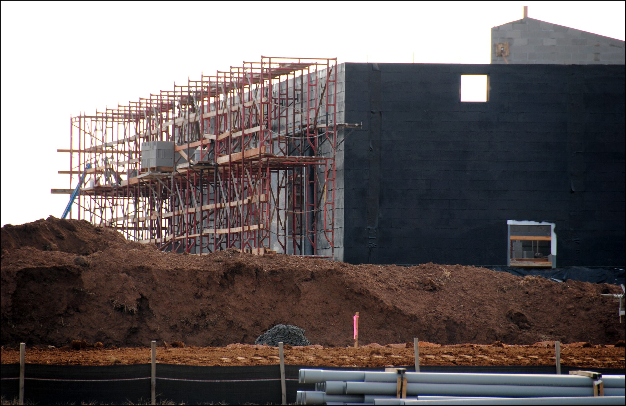 The 9,000 square-foot operations maintenance building, part of the Armed Forces Reserve Center under construction on the south end of Vance AFB, will provide space to service more than 150 wheeled vehicles used by Soldiers with the Army Reserve and Oklahoma Army National Guard. Construction on the $20 million center is ahead of schedule, said Braven Dyer, the project engineer with the U.S. Army Corps of Engineers. A ground breaking ceremony was held June 24 this year and TCI Architects/Engineers/Contractor, Inc., from La Crosse, Wis., began work July 14. The scheduled completion date of the operations building and a 60,000 square-foot training building is Oct. 27, 2010. (U.S. Air Force photo/ Joe B. Wiles)