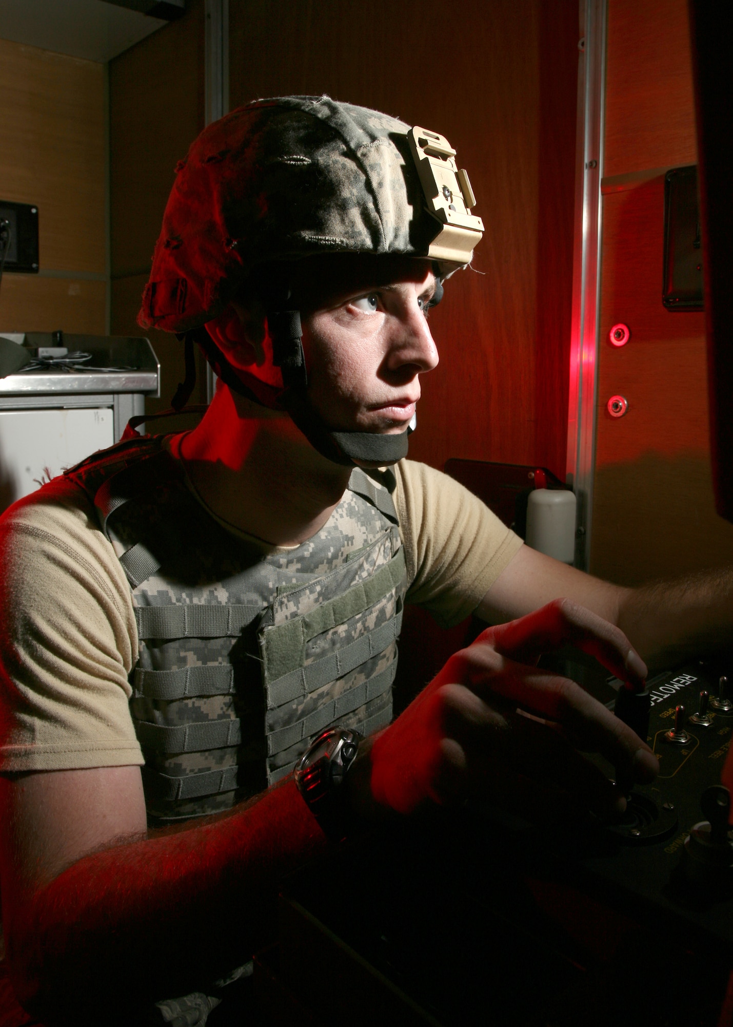 Senior Airman Trevor Brown moves a robot into position to inspect a suspected improvised explosive device during a training exercise Nov. 23 at Lackland Air Force Base, Texas. Airman Brown is an explosive ordnance disposal technician with the 37th Civil Engineer Squadron. (U.S. Air Force photo/Robbin Cresswell)