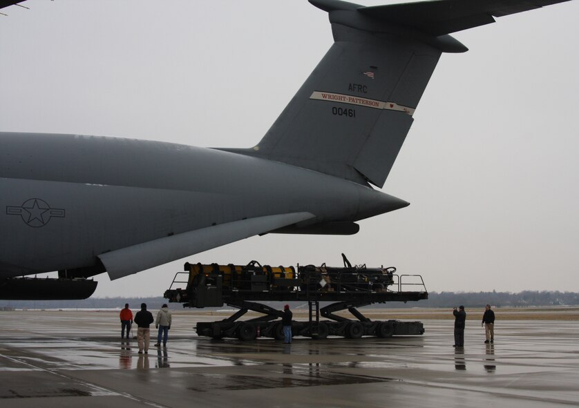 WRIGHT-PATTERSON AIR FORCE BASE, Ohio - The 445th Airlift Wing participated with the Air Force Security Assistance Center and the 88th Air Base Wing Dec. 23 to transport two snow removal vehicles and associated snow removal equipment from Wright-Patterson Air Force Base to its final destination of Kabul, Afghanistan. The plows will be used to clear runways at Kabul International Airport for the Afghan National Army Air Corps.  (U.S. Air Force photo/Stacy Vaughn)