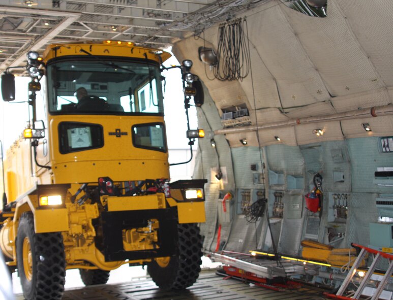 WRIGHT-PATTERSON AIR FORCE BASE, Ohio - The 445th Airlift Wing participated with the Air Force Security Assistance Center and the 88th Air Base Wing Dec. 23 to transport two snow removal vehicles and associated snow removal equipment from Wright-Patterson Air Force Base to its final destination of Kabul, Afghanistan. The plows will be used to clear runways at Kabul International Airport for the Afghan National Army Air Corps.  (U.S. Air Force photo/Stacy Vaughn)