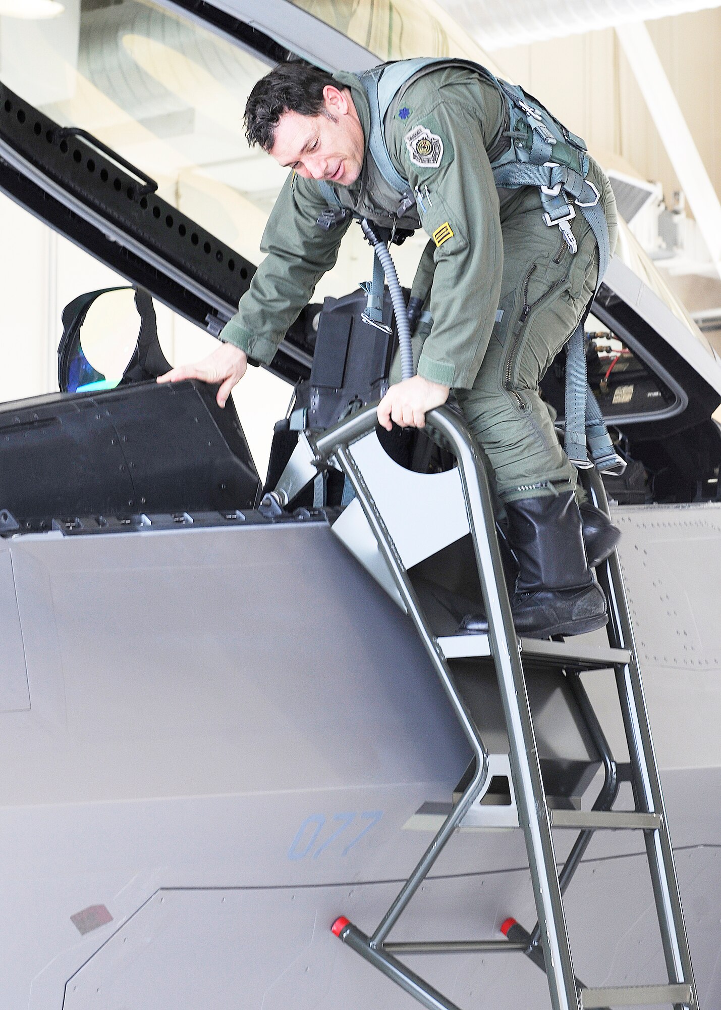 Lt. Col. Craig Baker exits the first F-22 Raptor assigned to the 8th Fighter Squadron after flying it to Holloman Air Force Base, N.M., Dec. 21, 2009. The arrival of 8th FS flagship starts the next chapter of the storied history of the Black Sheep that began in 1941 when the squadron was assigned to the 49th Pursuit Group. Colonel Baker is the 8th Fighter Squadron commander. (U.S. Air Force photo/Senior Airman John D. Strong II)