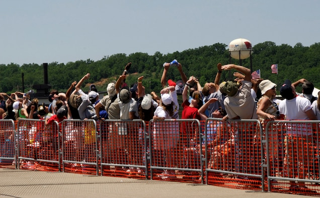 Spectators observe a performance by the Unites States Air Force's Thunderbirds, an F-16 Falcon demonstration team, during an air show May 18, 2008, at the 188th Fighter Wing in Fort Smith, Ark. The 2008 air show drew a record crowd of more than 200,000 during the two-day event. (U.S. Air Force photo by Tech Sgt. Stephen Hornsey/188th Fighter Wing Public Affairs)