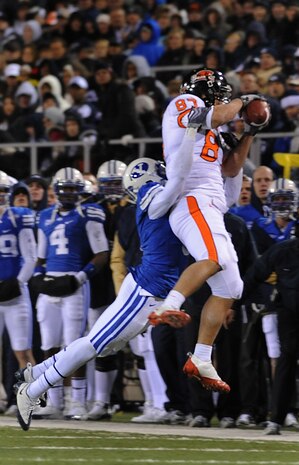 LAS VEGAS -- James Rodgers of the Oregon State Beavers catches the football while Brandon Bradley of the Brigham Young University Cougars makes the tackle in the second quarter of the MAACO Las Vegas Bowl at Sam Boyd Stadium, Dec. 22. Over 200 hundred Airmen from Nellis and Creech Air Force Bases attended the game after unfurling the flag for the opening ceremonies.
(U.S. Air Force photo by Airman 1st Class Brett Clashman)























  












 











































  












 
























