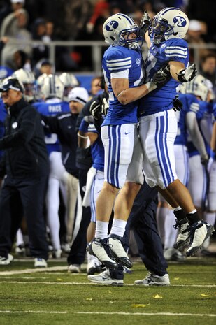 LAS VEGAS - Shawn Doman and Vic So'oto of the Brigham Young University Cougars celebrate after Doman recovered a fumble inside the Oregon State Beavers 20 yard line during the fourth quarter of the MAACO Las Vegas Bowl at Sam Boyd Stadium December 22, 2009 in Las Vegas, Nevada. Over 200 hundred Airmen from Nellis and Creech Air Force Bases attended the game after unfurling the flag for the opening ceremonies.
(U.S. Air Force photo by Tech. Sgt. Michael R. Holzworth)