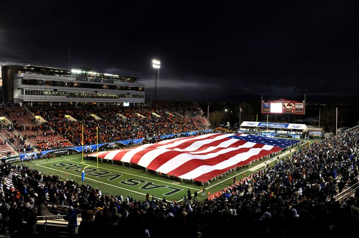 LAS VEGAS - Airman from Nellis and Creech Air Force Bases display a giant American flag during pre-game ceremonies at the MAACO Las Vegas Bowl featuring the Brigham Young University Cougars and the Oregon State Beavers at Sam Boyd Stadium Dec. 22. (U.S. Air Force photo by Tech. Sgt. Michael R. Holzworth)