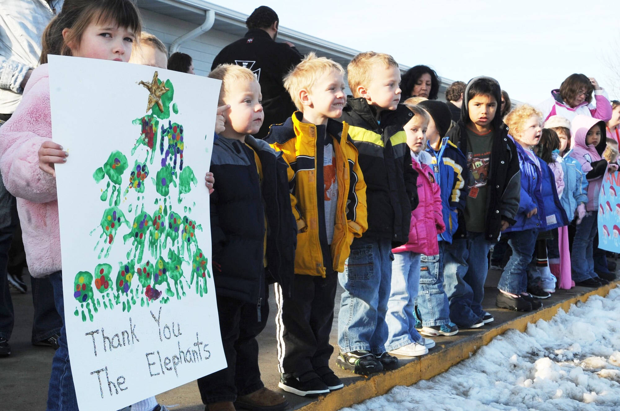 Children of the Youth and Family Services child care center wait for Santa and Mrs. Claus' arrival Dec. 17, 2009, in Rapid City, S.D. This is the third time Santa, Mrs. Claus and Airmen from Ellsworth Air Force Base, S.D., bought, wrapped and delivered gifts for every child at the center. (U.S. Air Force photo/Airman 1st Class Corey Hook)