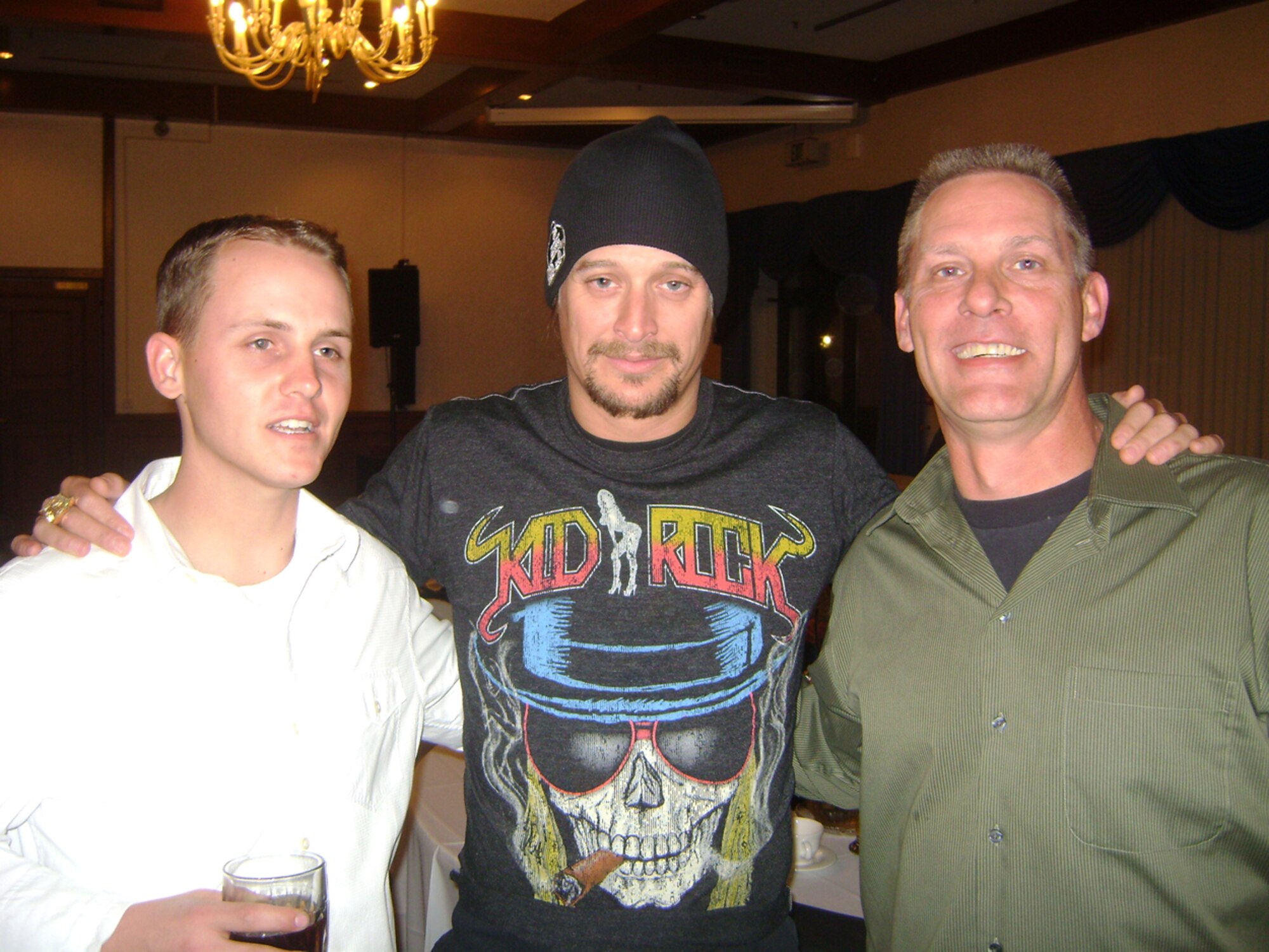 Staff Sgt. Marshall Oswalt (far left), Tech. Sgt. Glen Pearson (far right) and other Airmen were able to meet singer Kid Rock during a 2009 Tour for the Troops reception party. Both sergeants, from the 931st Aircraft Maintenance Squadron at McConnell Air Force Base, Kan., were part of KC-135 Stratotanker crew that supported the tour. (Courtesy photo)                        