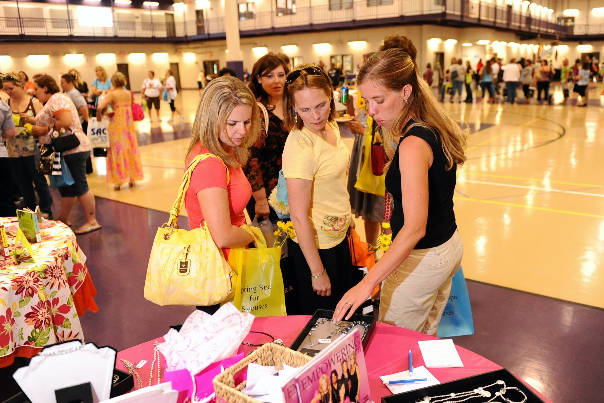 OFFUTT AIR FORCE BASE, Neb. - Offutt?s military spouses attend the 2009 Spring Spa for Spouses held at the Lied Activity Center, and were treated to a vast array of booths offering everything from books to massages to martial arts lessons 21 May.  Roughly 400 women attended the Spring Spa for Spouses spending the evening getting a much deserved break from daily military spousal responsibilities.  U.S. Air Force Photo by Josh Plueger
