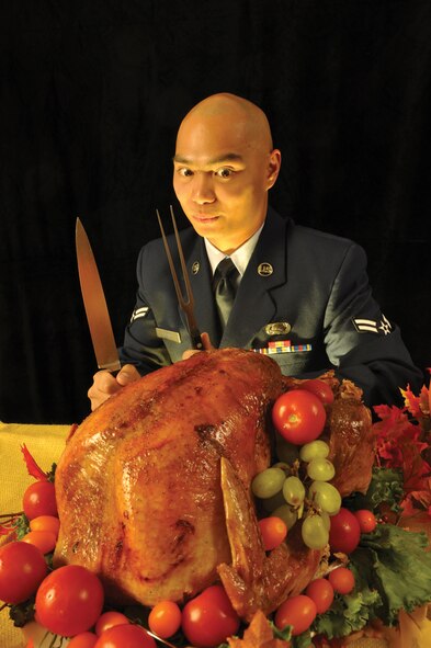 Photo by Frank Copeland. Airman 1st Class Glenn Giron, 2d Force Support Squadron, represents the Holiday Spirit at Barksdale while posing for the front cover of the November Barksdale Life newspaper.