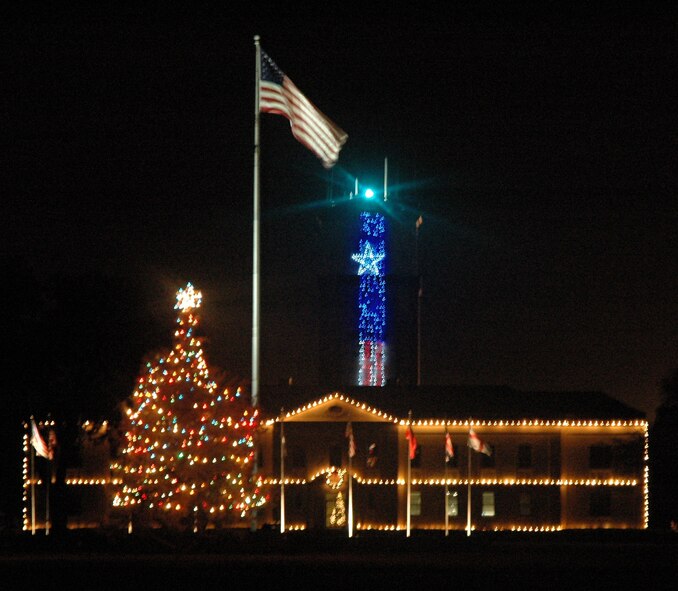 Photo by Rebecca Denton. Night time picture of the 2 Bomb Wing headquaters depicting the holiday spirit of Barksdale.