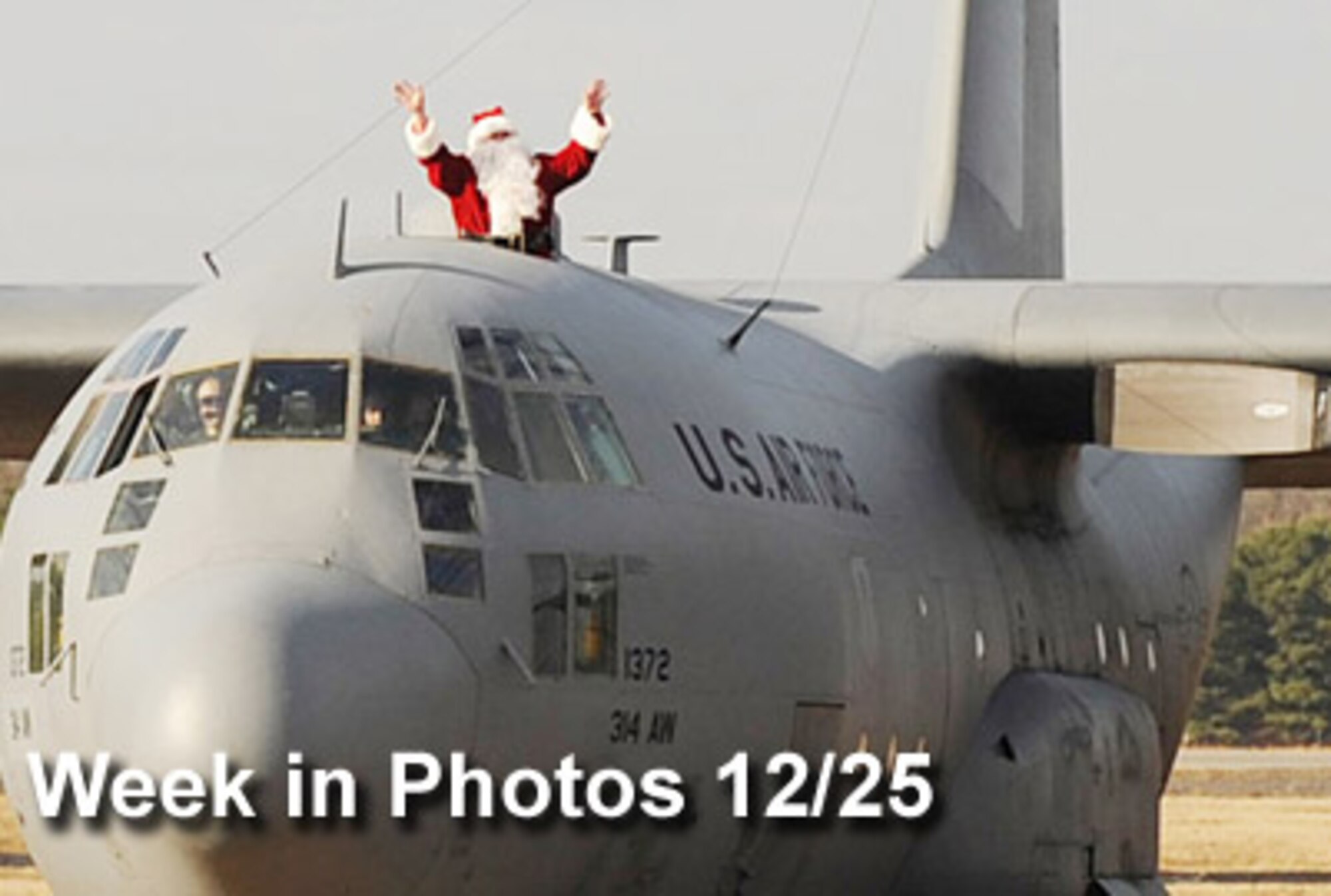 Air Force Week in Photos for Dec. 25 highlights photos from around the Air Force. In this photo Santa Claus waves from a C-130 Hercules as it taxis along the flightline at Little Rock Air Force Base, Ark., Dec. 18, 2009. Santa, aka Lt. Col. Lance Avery, made the early visit to the base for the 62nd Airlift Squadron children's holiday party.  (U.S. Air Force photo illustration) 