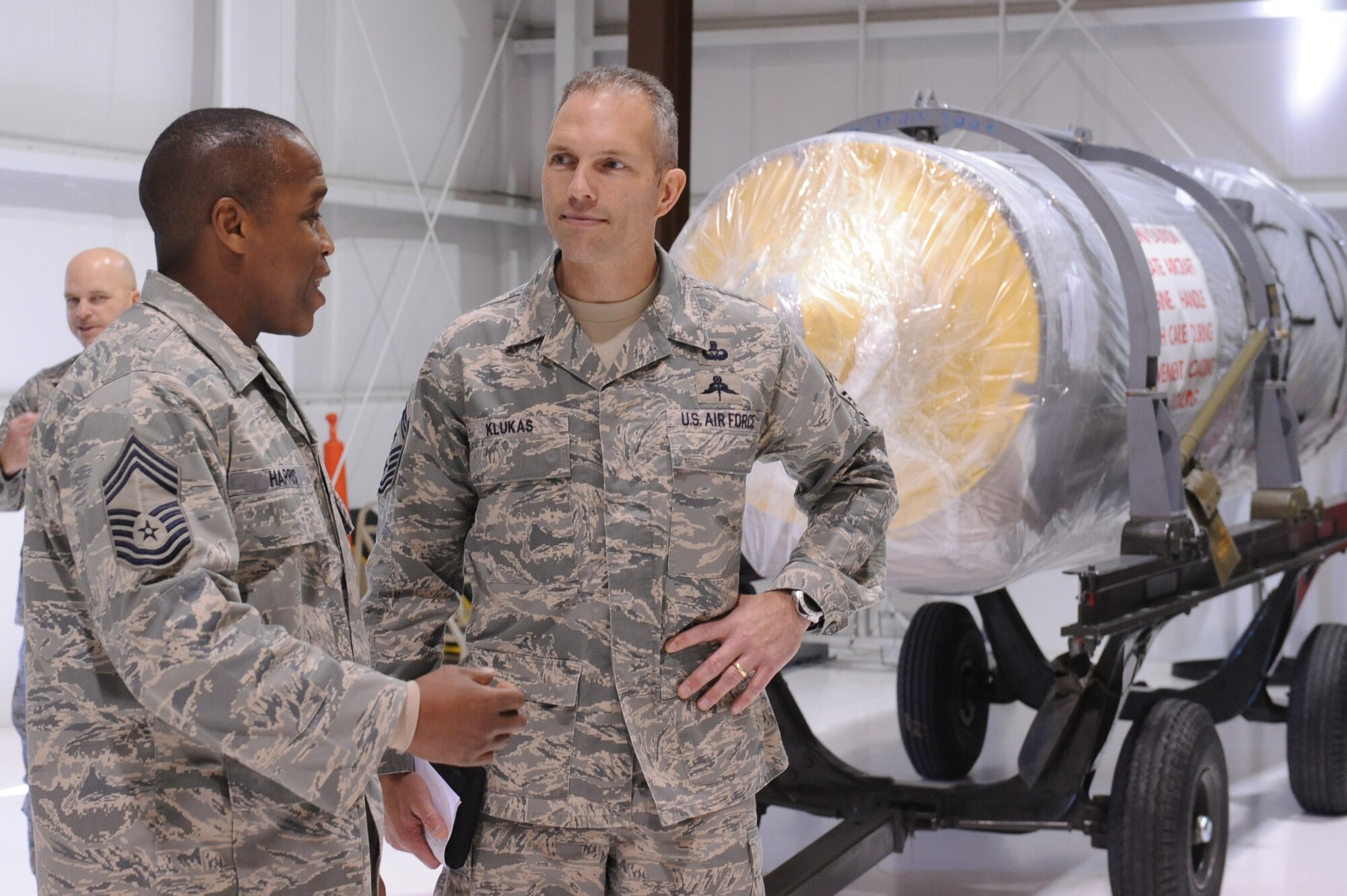 Chief Master Sgt. Owen Harris, 4th Component Maintenance Squadron propulsion flight chief, welcomes Chief Master Sgt. Martin Klukas, Air Combat Command command chief, to the 4th CMS propulsion flight at Seymour Johnson Air Force Base, N.C., Dec. 22, 2009. Chief Harris explains to Chief Klukas the different duties his Airmen perform. (U.S. Air Force photo/Senior Airman Whitney Lambert)