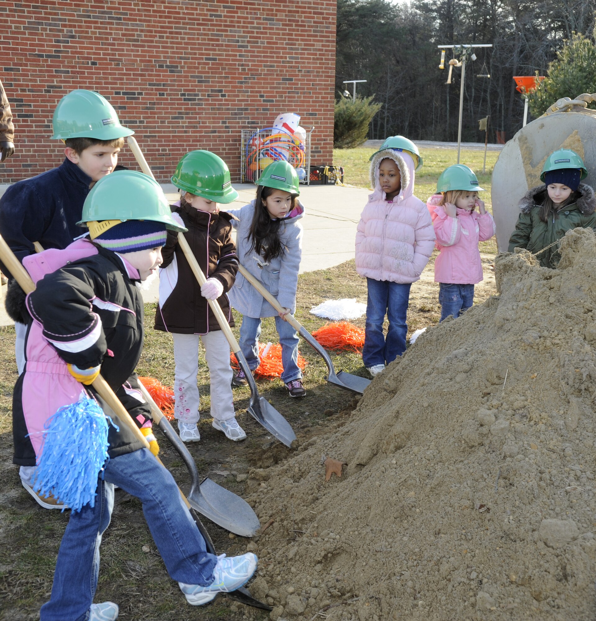 A crew made up of students  from Fort Dix Elementary school break ground for their new gym at a ceremony here Dec.17.The new gym will be used by the school and the local community. This year, JB MDL servicemembers and their families are celebrating "The Year of the Military Family." Constructing new facilities, such as the new gym, demonstrates the military's strong commitment to enhacning the quality of life for servicemembers and their families. (U.S. Air Force photo/Carlos Cintron)

