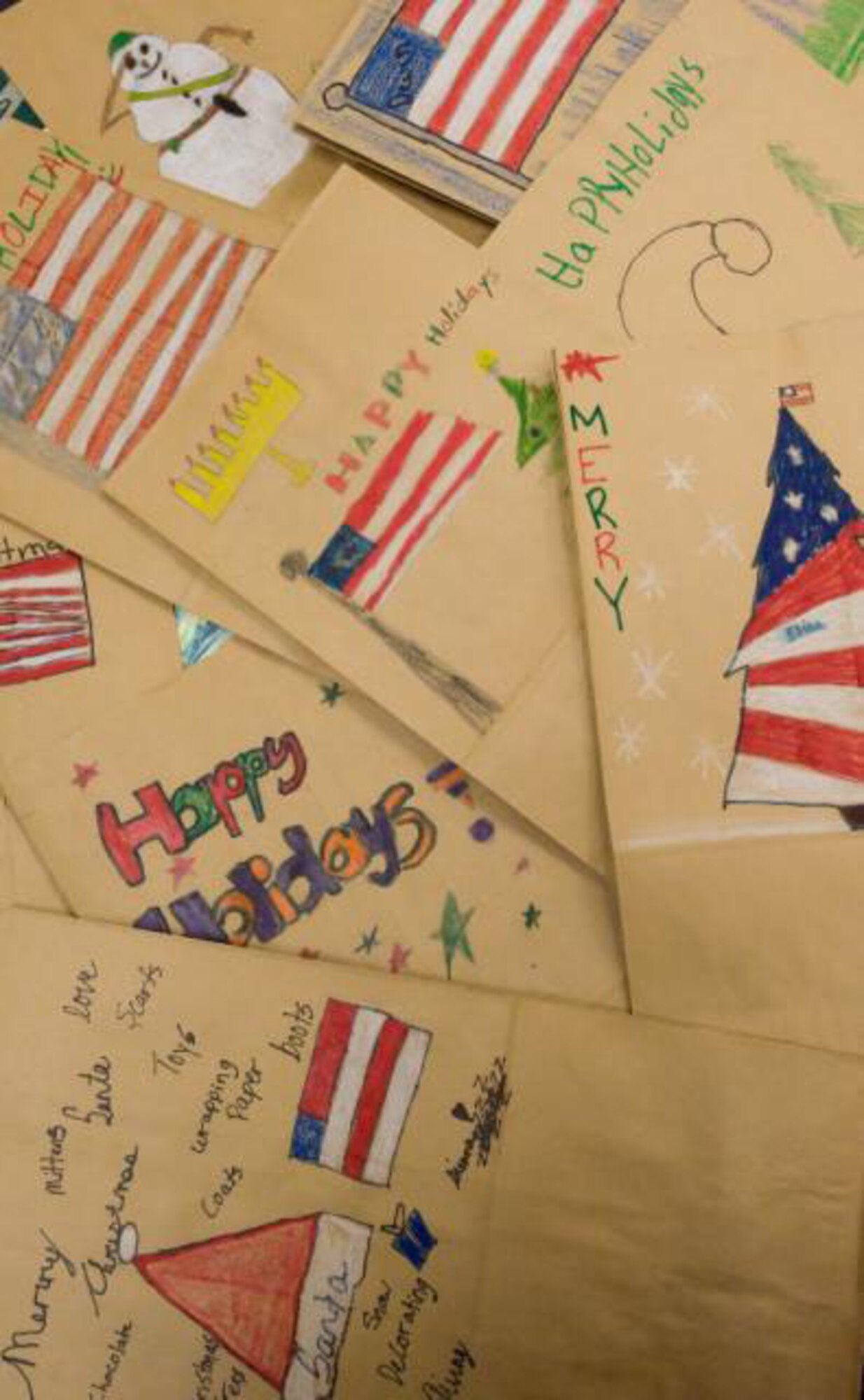 The fourth grade class at Welch Elementary teams up with the USO Delaware to help spread holiday cheer by decorating paper bags that will be filled with goodies and handed out at Operation Cookie Drop and to servicemembers deploying this holiday season. (US Air Force photo / Jason Minto)