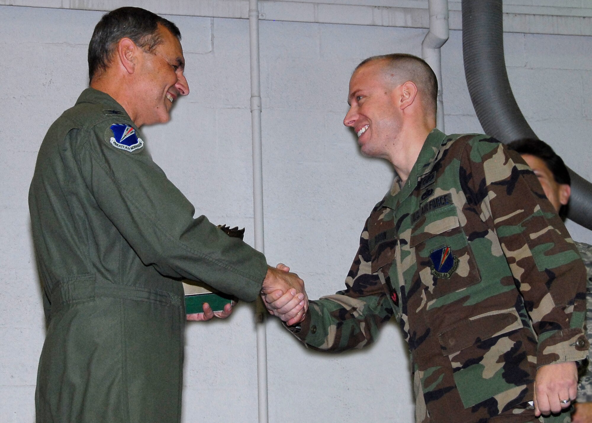 First Lieutenant Mike Durbin, 131FM, Outstanding Officer of the Year 2009, receives an Eagle trophy from Col Robert Leeker, 131st Bomb Wing commander, during the 131st Outstanding Airman of the Year awards on Dec 6 at Lambert-Saint Louis ANGB..  (Air Force Photo by Master Sgt Mary-Dale Amison   RELEASED)
 