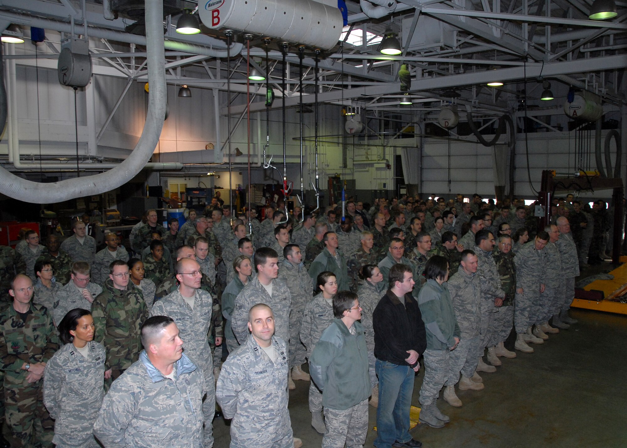 Members of the 131st Bomb Wing, Missouri Air National Guard, gather at the Motorpool at Lambert-Saint Louis ANGB for the Outstanding Airman of the Year Ceremony on Dec 6.  The same ceremony was held at Whiteman Air Force Base on December 5 so all wing members could participate.  (Air Force Photo by Master Sgt Mary-Dale Amison RELEASED)
 