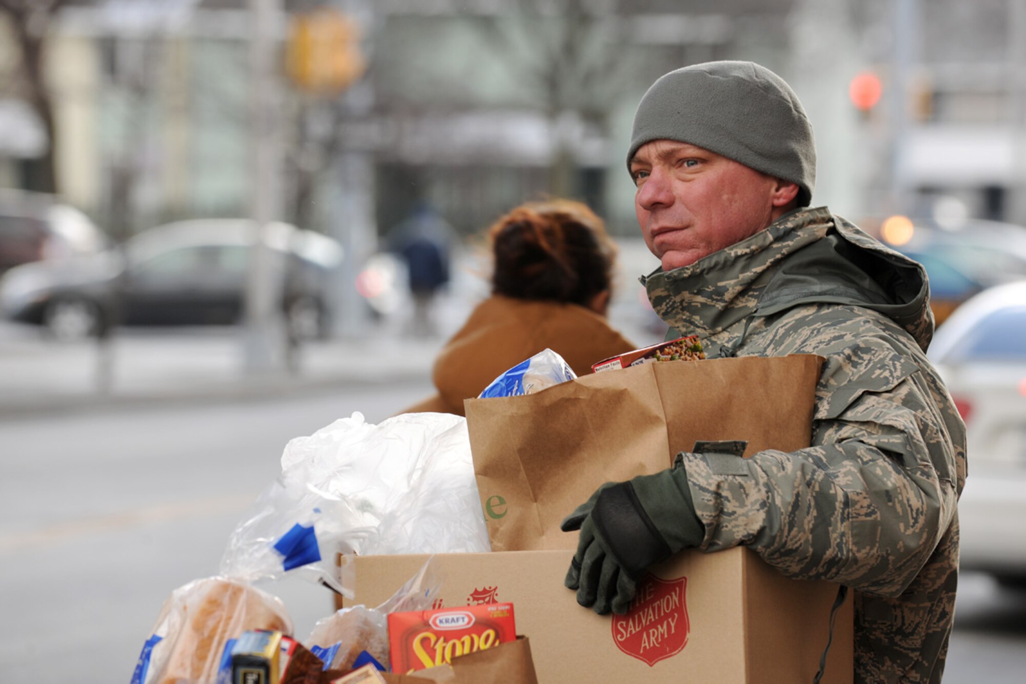 US Air Force Master Sgt. Christopher S. Duffy prepares to carry a box of food items to a car at the Oncenter Complex in Syracuse, NY on 22 Dec. 2009. Addley was volunteering at the Annual Christmas Bureau Salvation Army Food and Gift drive supplying needy families with gifts for their children and food for their Holiday meal. (US Air Force photo by Tech. Sgt. Jeremy M. Call/Released)