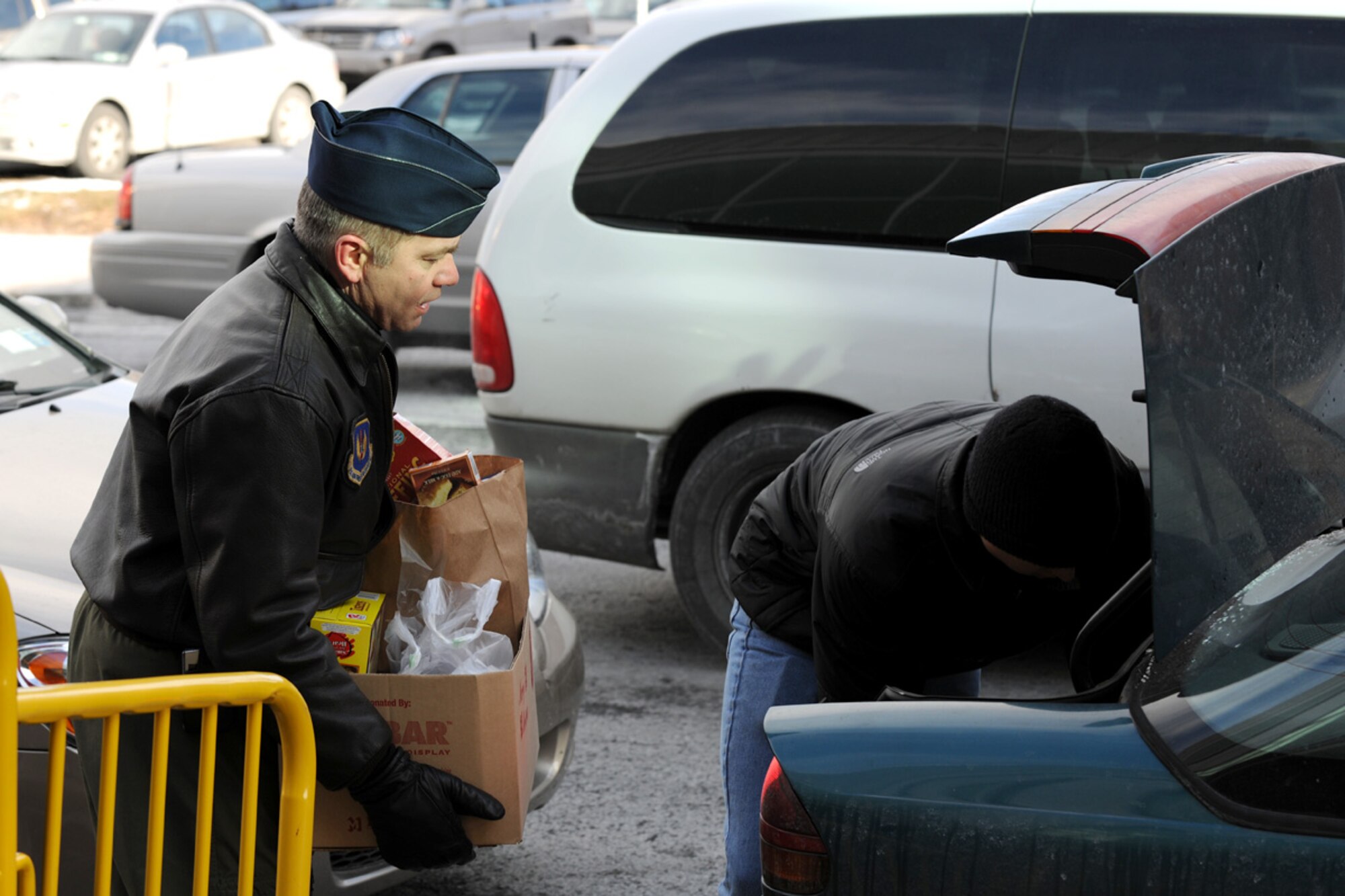 US Air Force 152nd Air Operations Group Commander Lt. Col. Richard D. Howard loads a box of food items into a trunk at the Oncenter Complex in Syracuse, NY on 22 Dec. 2009. Howard was volunteering at the Annual Christmas Bureau Salvation Army Food and Gift drive supplying needy families with gifts for their children and food for their Holiday meal. (US Air Force photo by Tech. Sgt. Jeremy M. Call/Released)