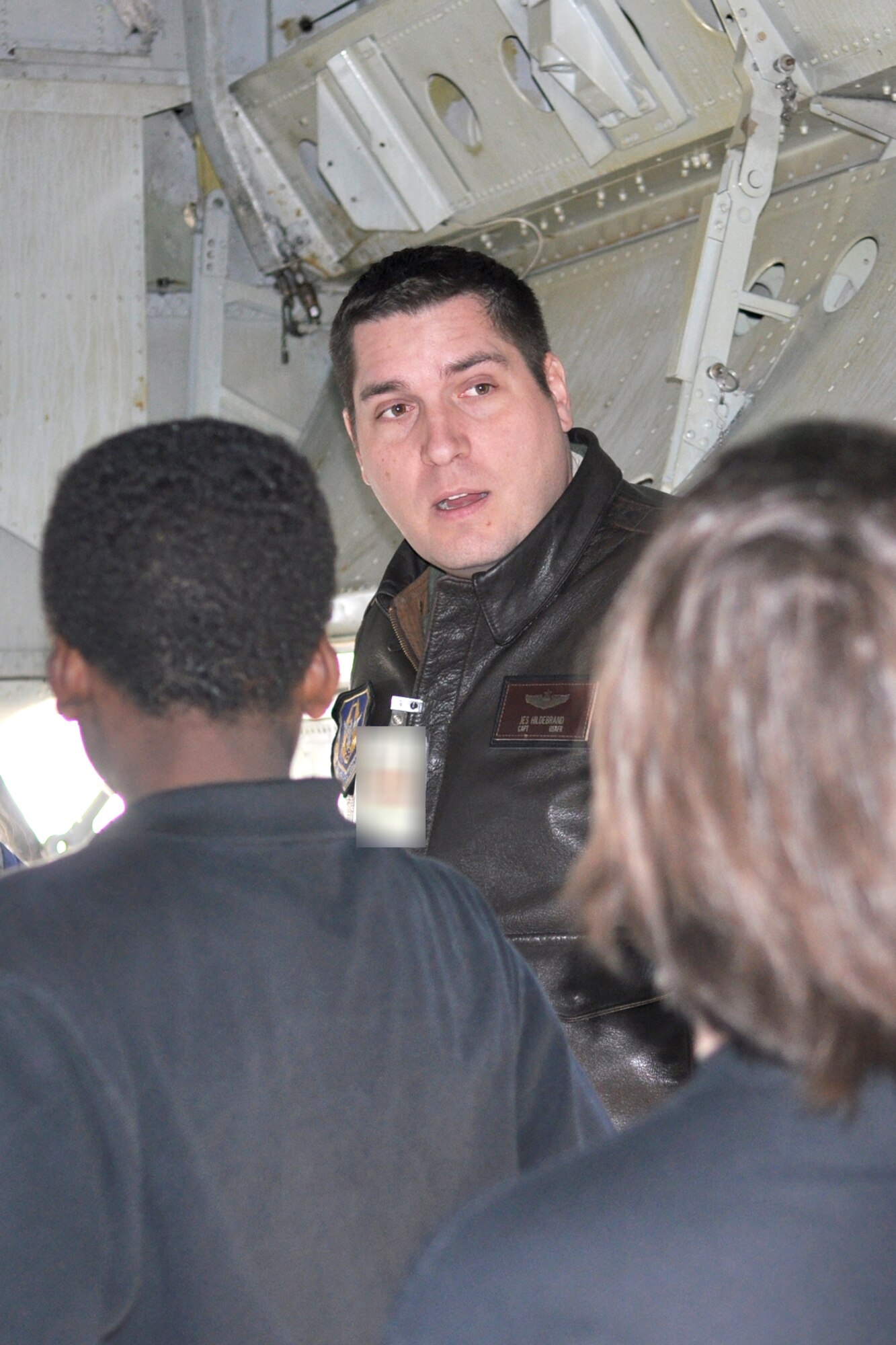 Capt. Jesse Hildebrand, a B-52 Stratofortess commander for the 93rd Bomb Squadron, educates 32 students who attained the highest grade point averages from the aerospace course at Rusheon Middle School in Bossier City, La., about the aircraft and its capabilities. Capt. Hildebrand led a walk-through of the aircraft during an on-base tour of the 917th Wing on Barksdale Air Force Base, La.  (U.S. Air Force Photo/ Senior Airman Crystal Marie Jordan)